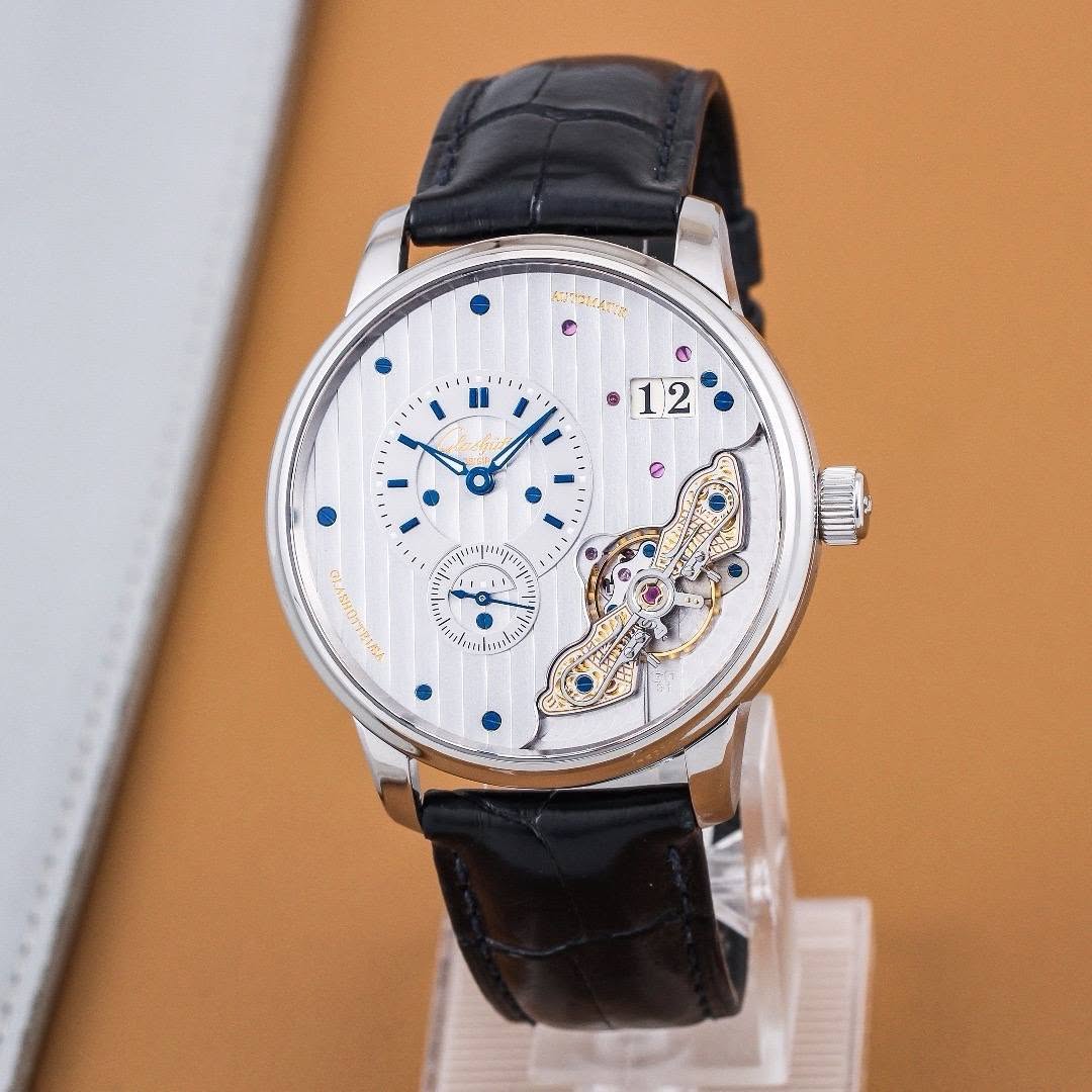 May be an image of wrist watch and text