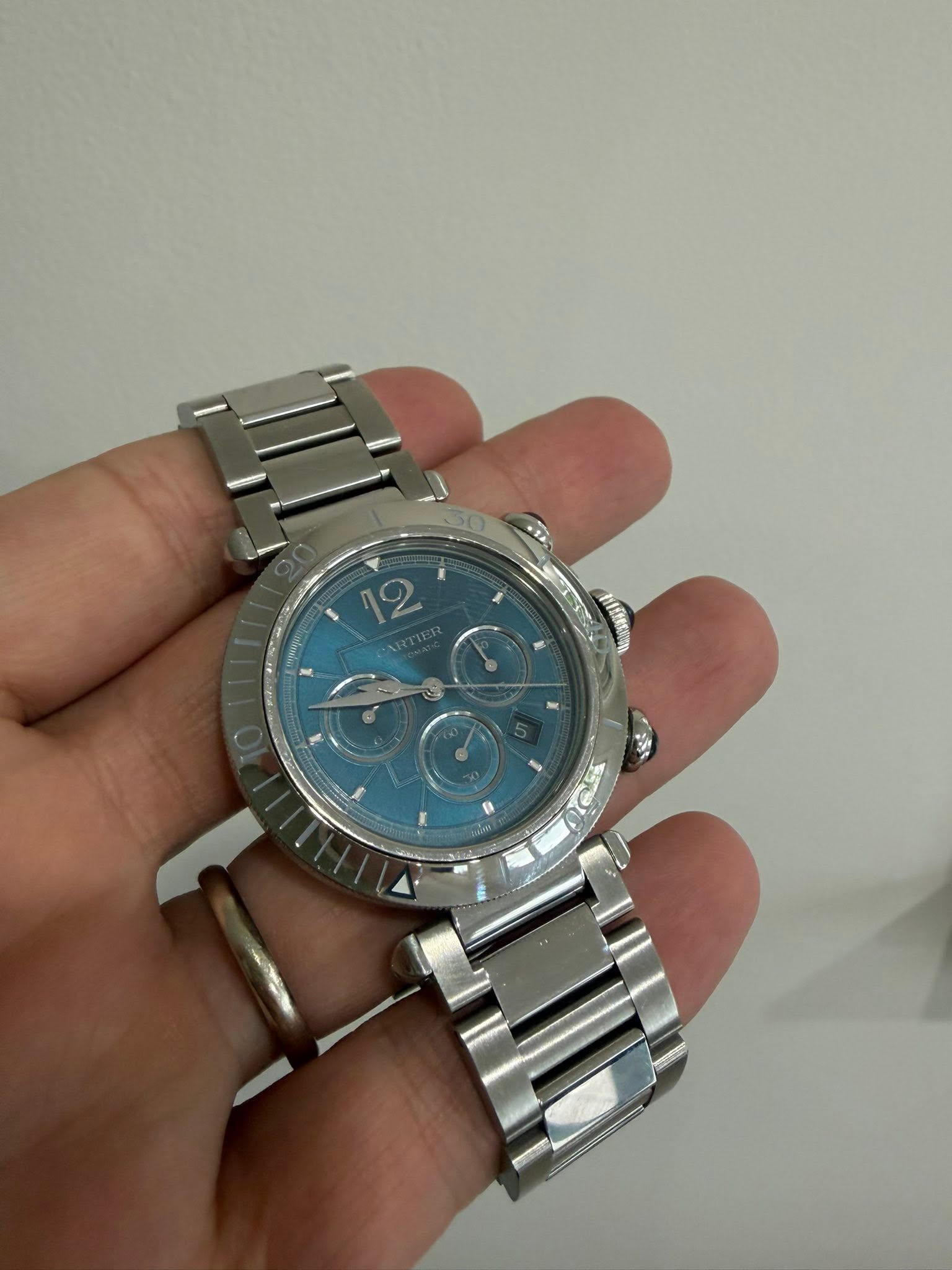May be an image of wrist watch and text