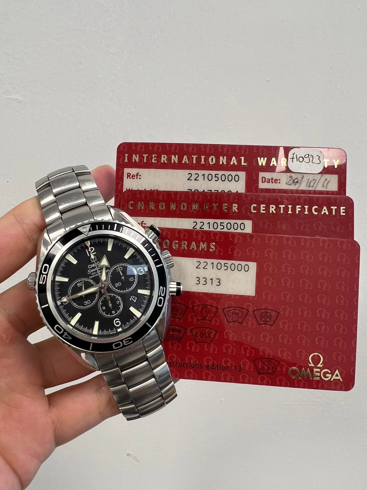 May be an image of ticket stub, wrist watch and text that says 'مسماس INTERNATIONAL WAR+10923 WAR 71o923 Ref: 22105000 Date: 20/ 20/10/11 112/41 ER R Ir CERTIFICATE 22105000…