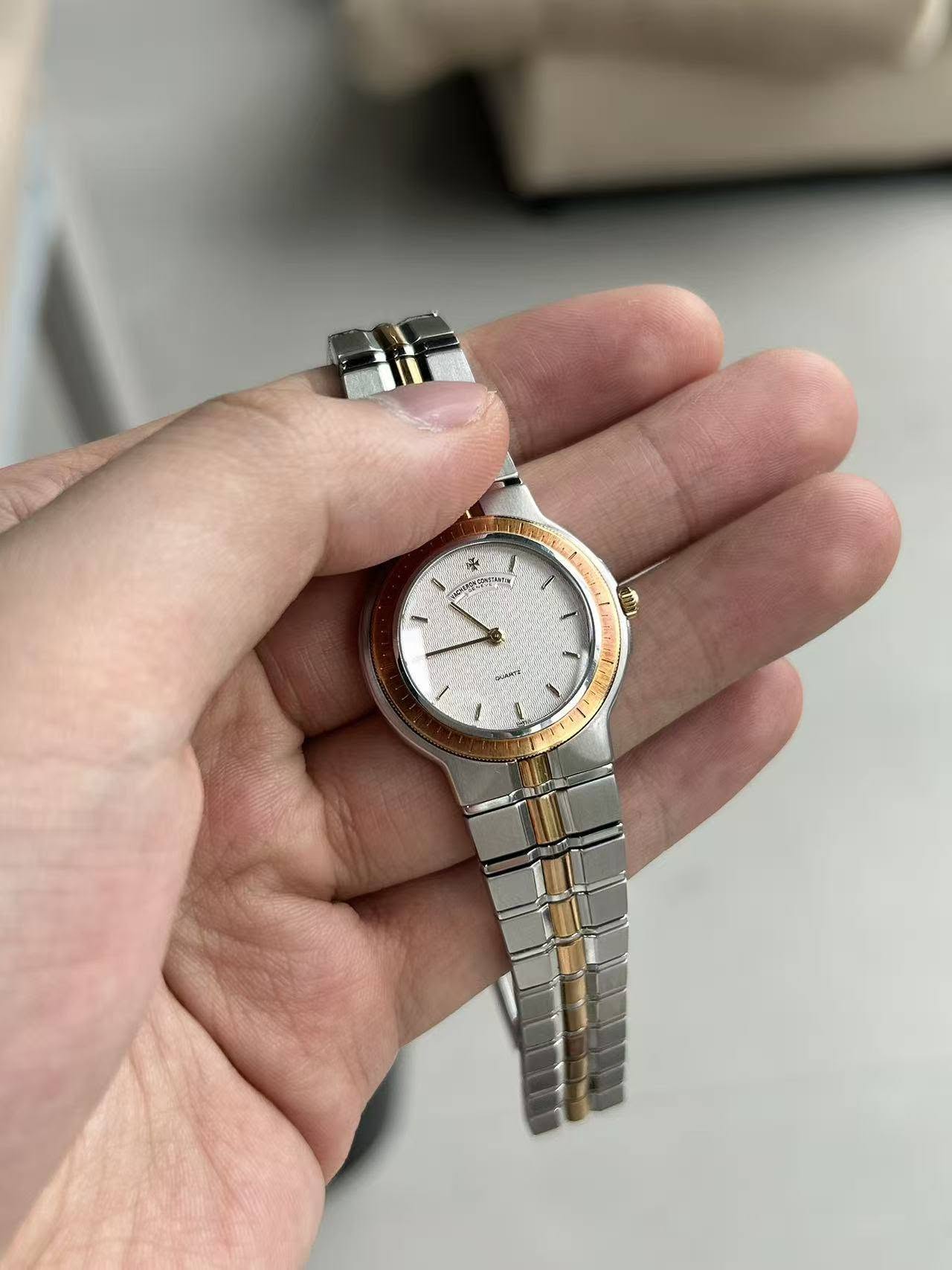 May be an image of wrist watch and text