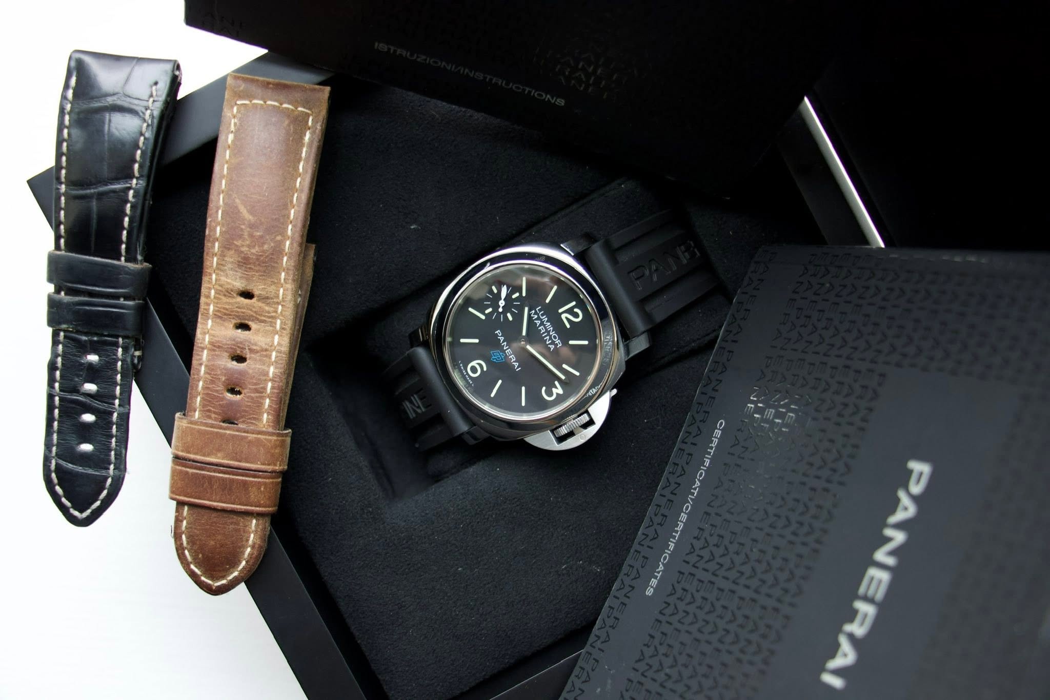 May be an image of leather, wrist watch and text