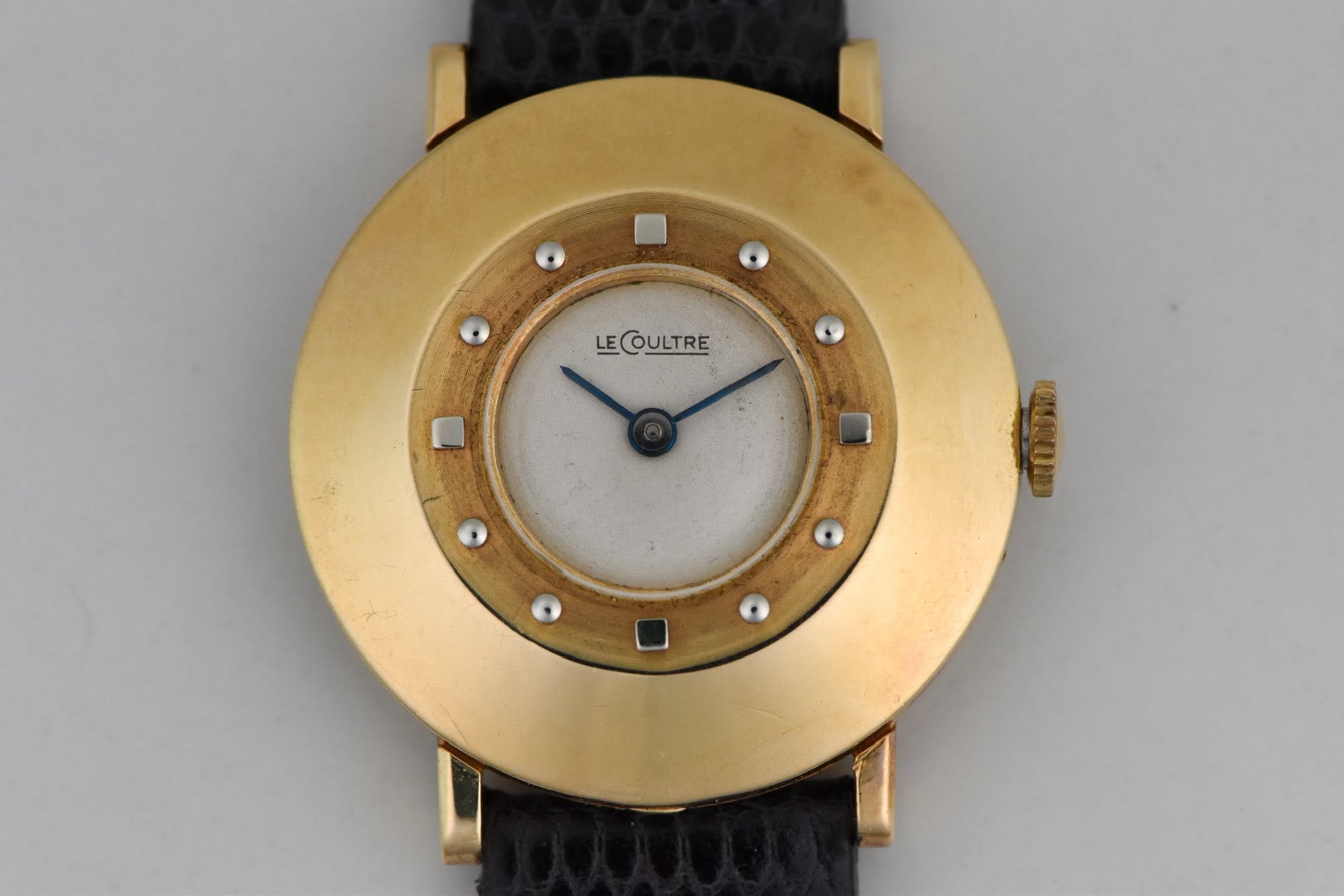 May be an image of wrist watch and text that says 'LECOULTRE LE'