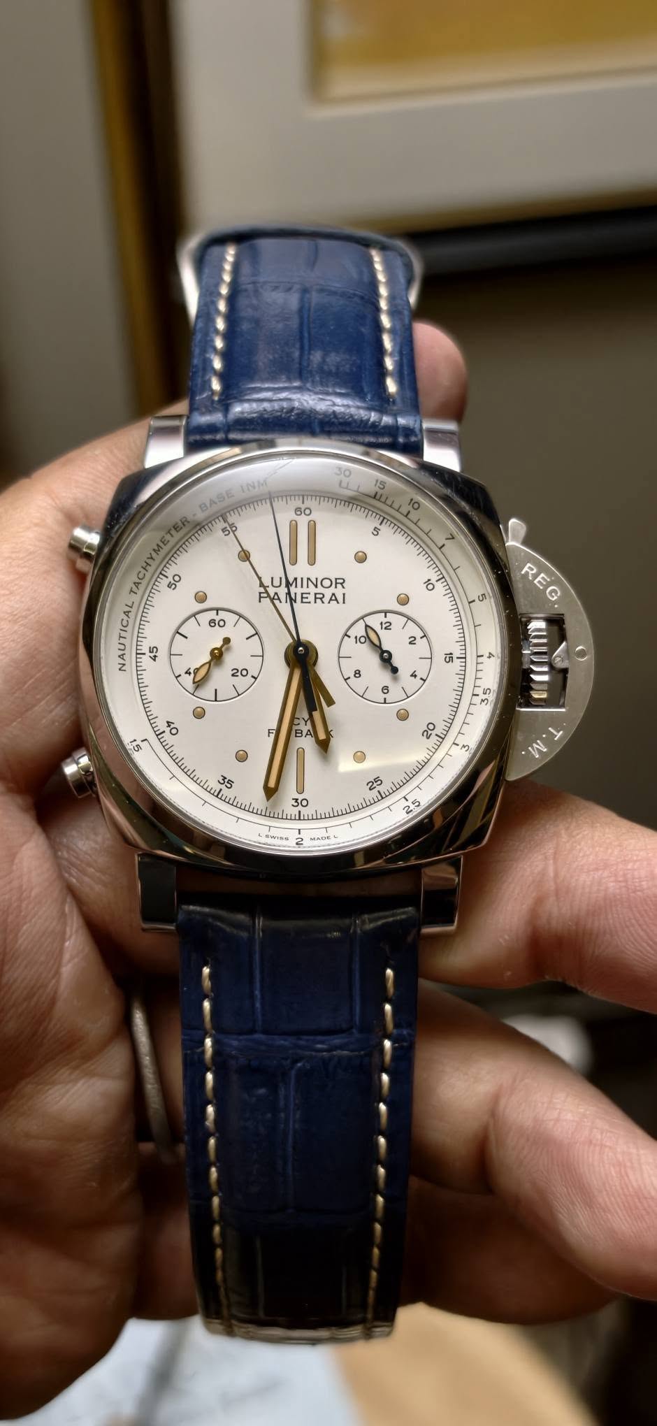 May be an image of wrist watch and text
