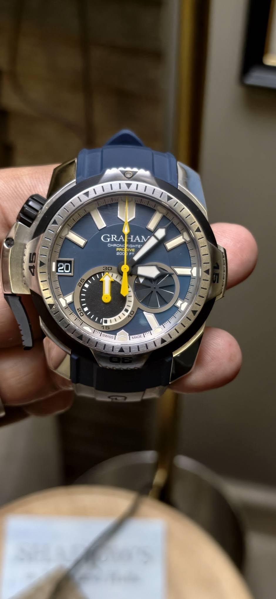 May be an image of wrist watch and text