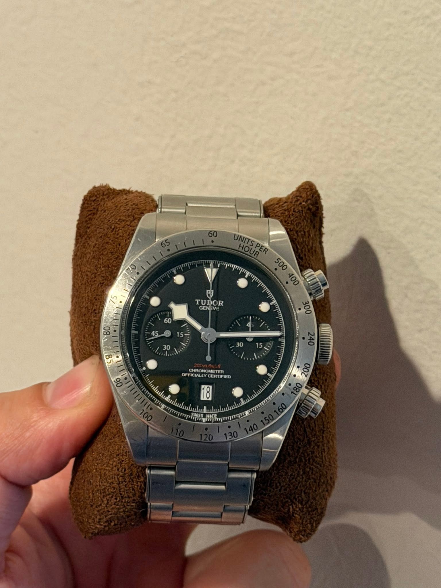 May be an image of wrist watch and text