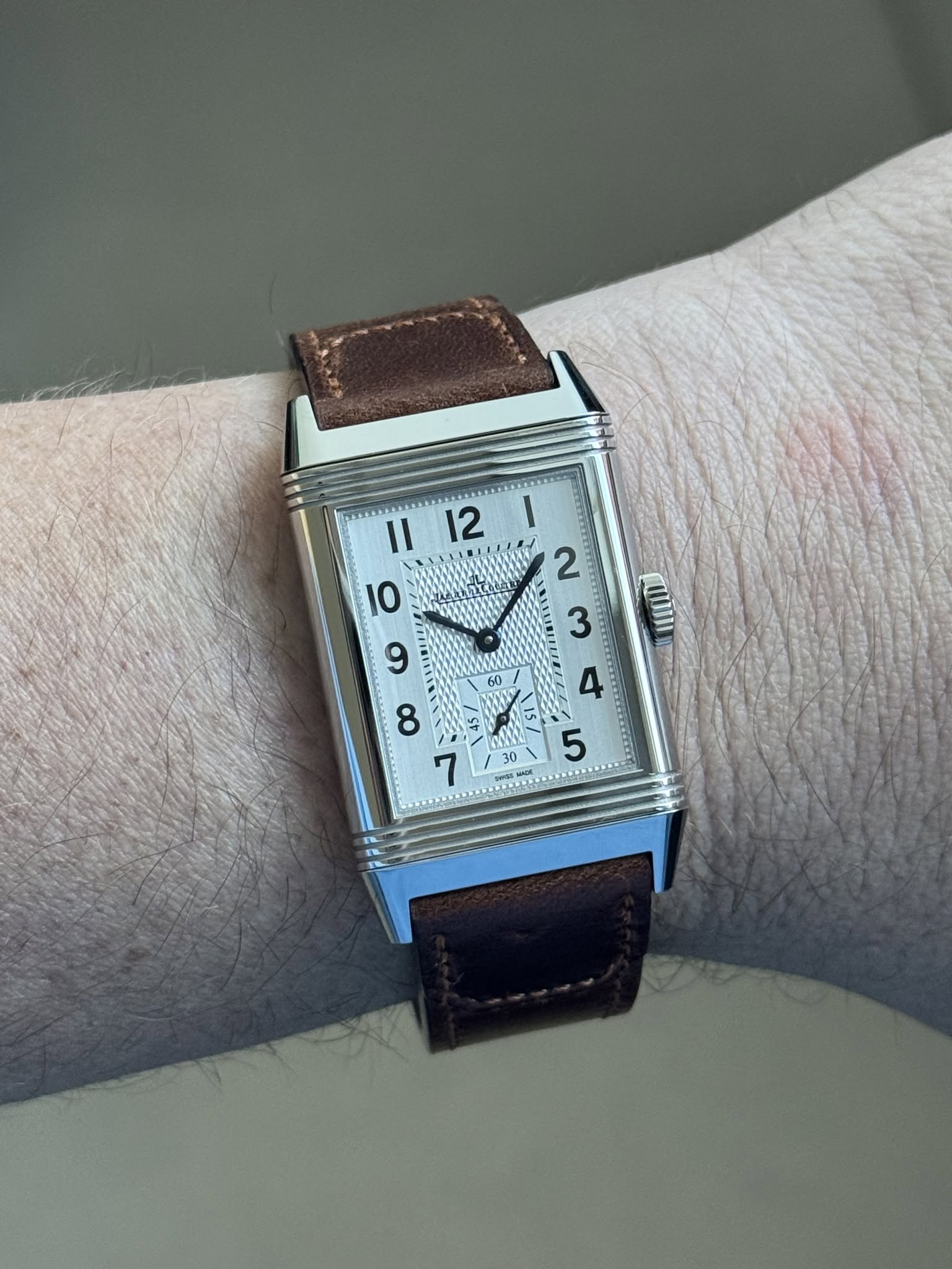 May be an image of wrist watch and text