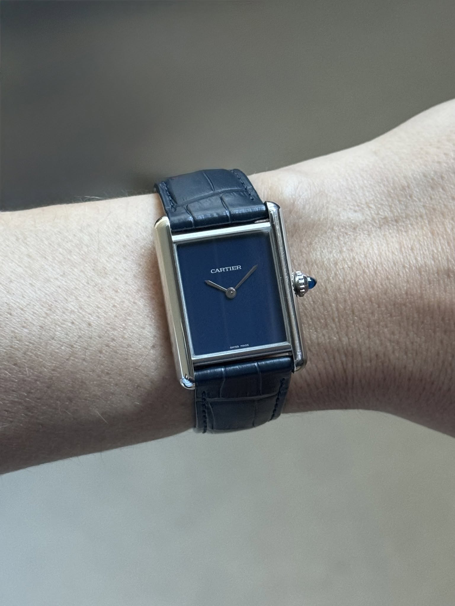 May be an image of wrist watch and text