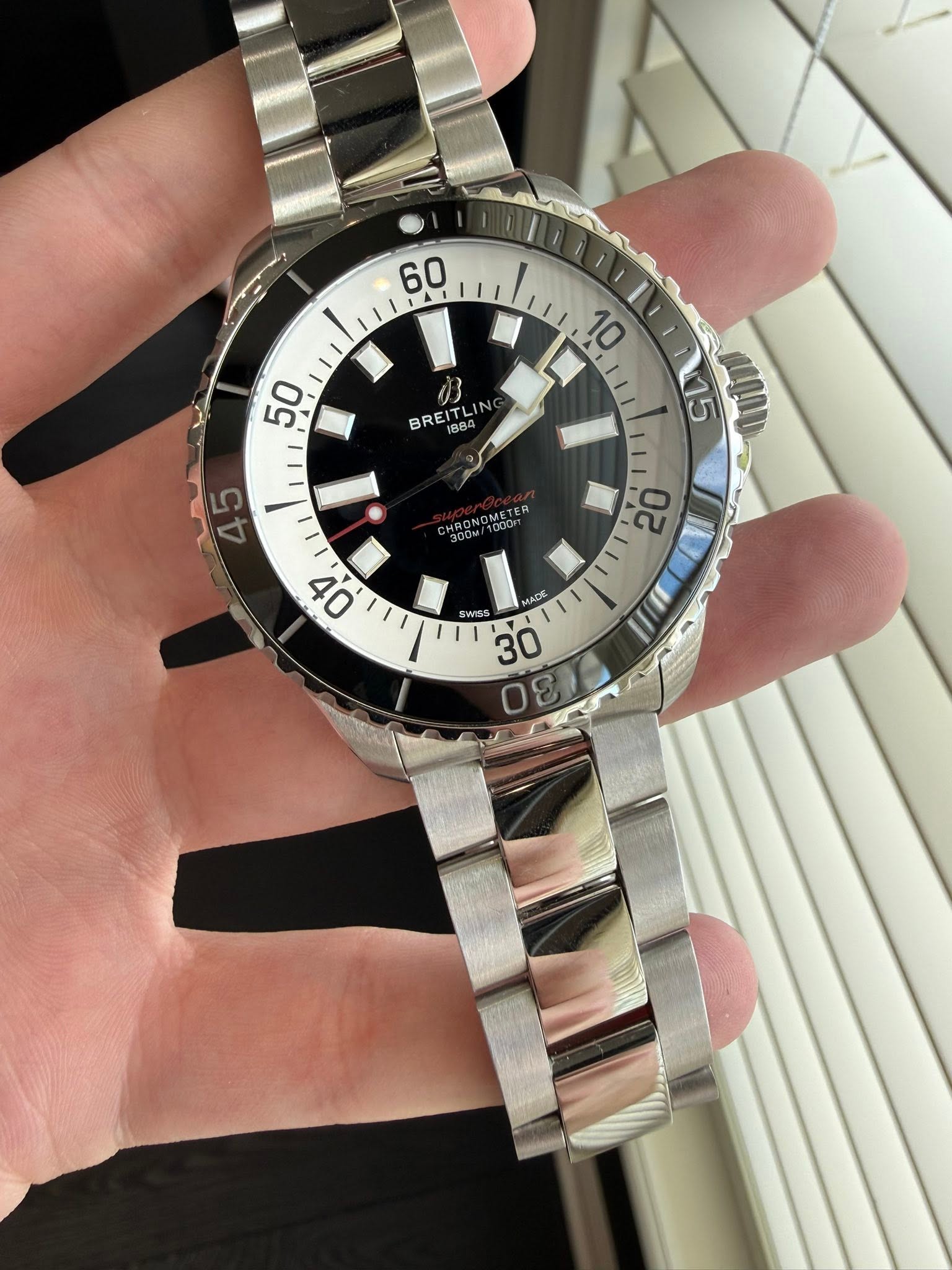 May be an image of wrist watch and text that says '60 50 BREITLIN 884 LIN μAAη 45 OMETER 20 0t MAO O 2 SWISS اااوو 0ε 300 00'