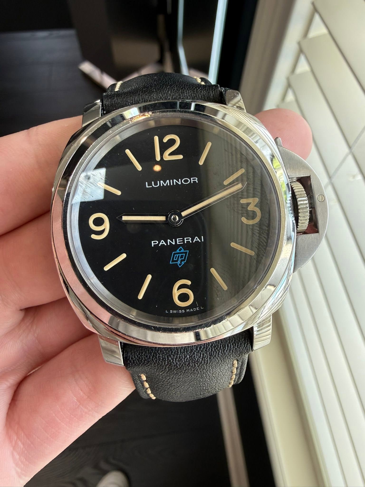 May be an image of wrist watch and text that says '12 ,2!1 / LUMINOR 3 O 9 PANERAI 0091! 6'