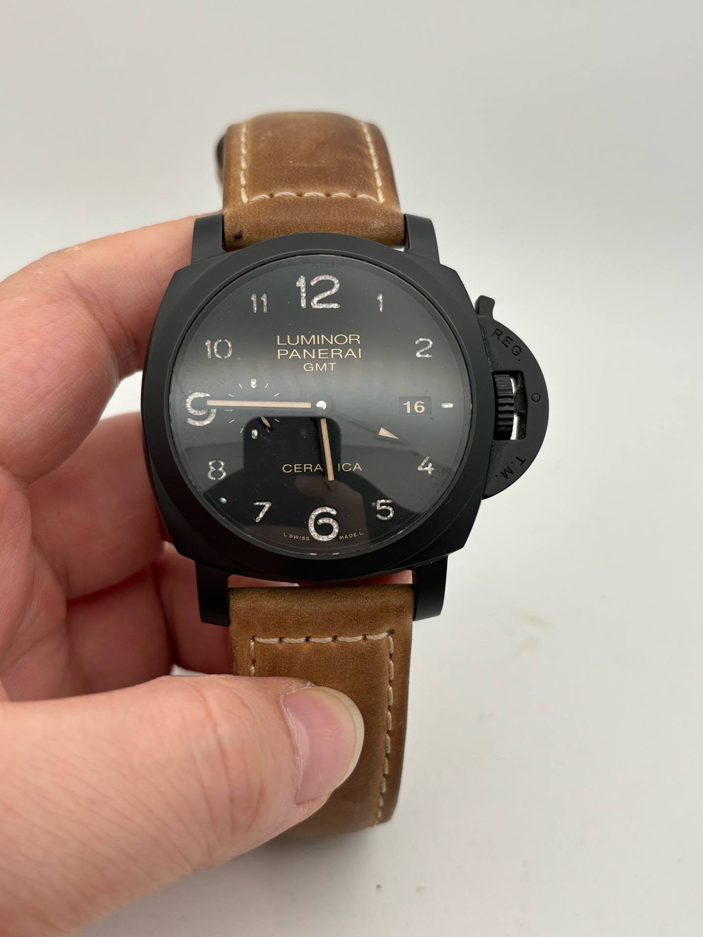 May be an image of leather, digital watch and text that says ' LUMINOR PANERAI GMT CERA CA പන MC O AdO'
