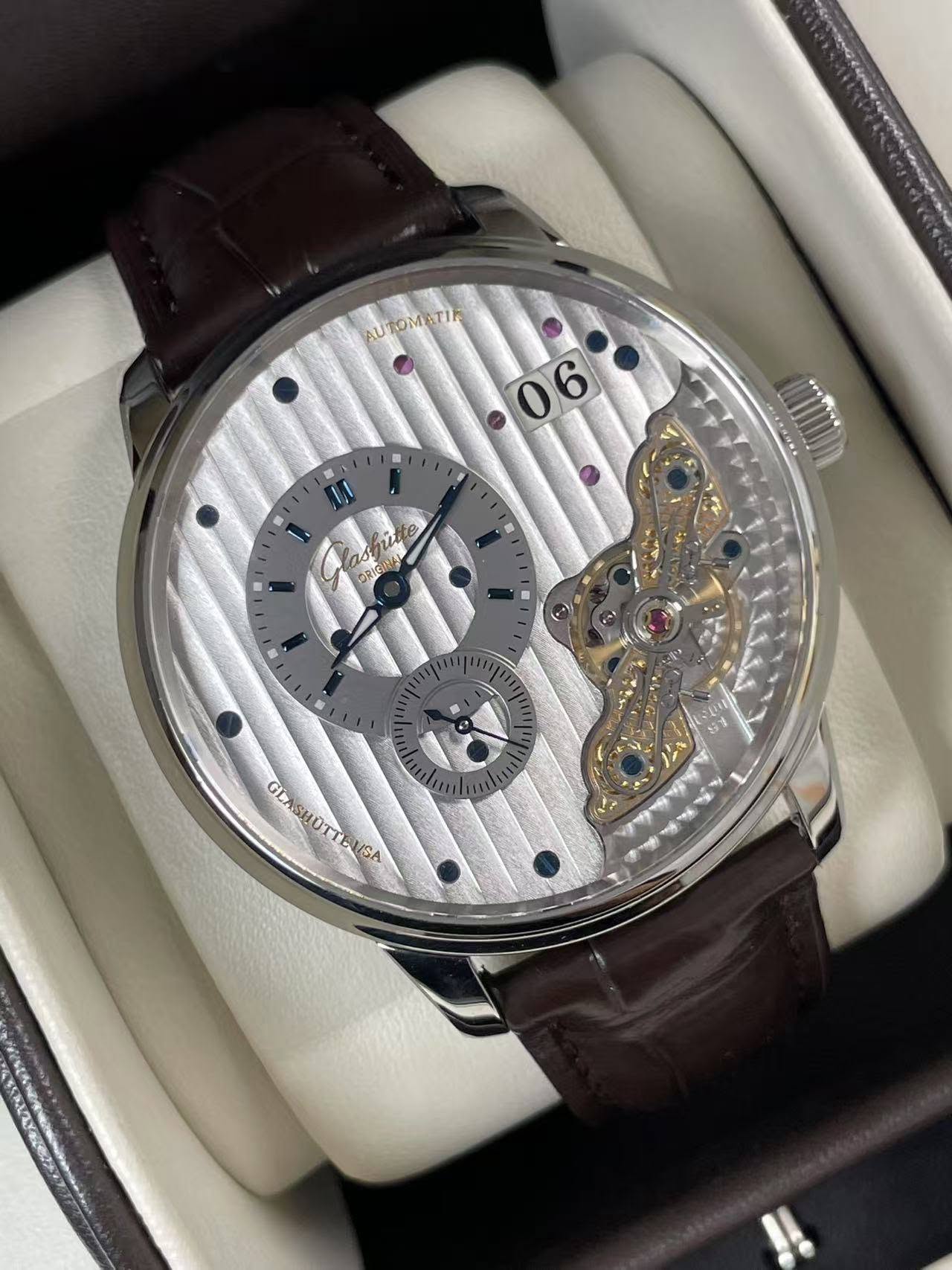 May be an image of wrist watch and text
