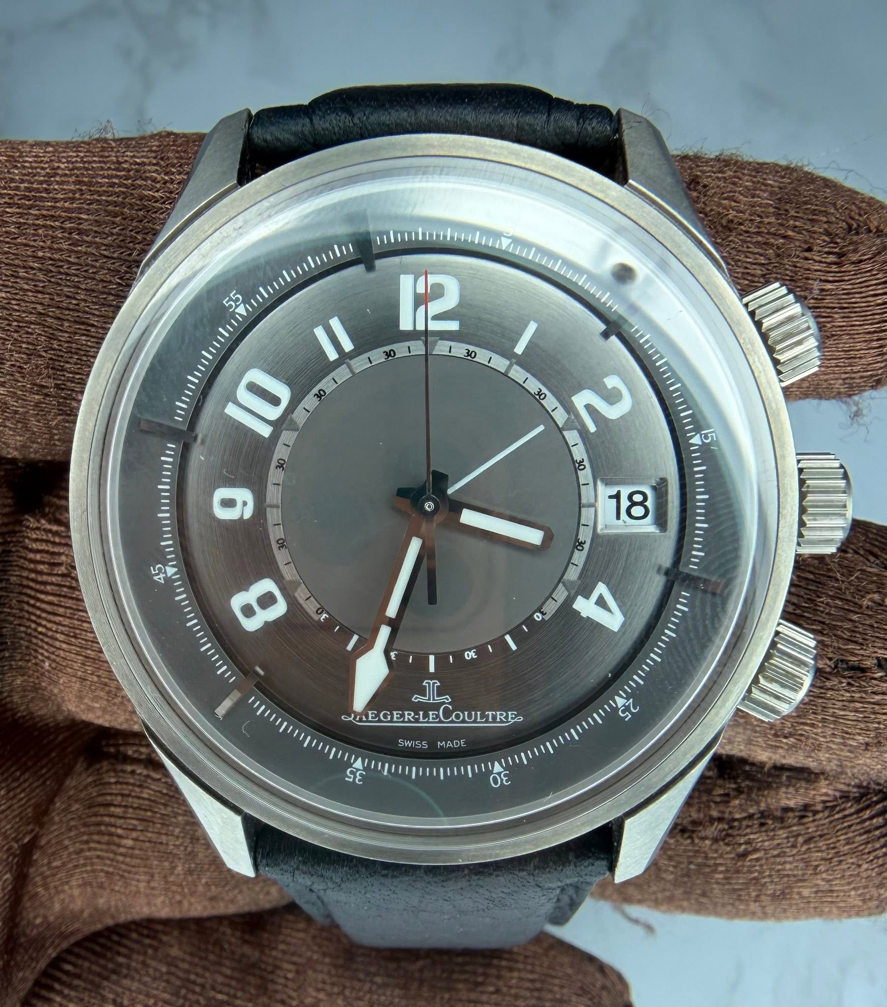 May be an image of wrist watch and text