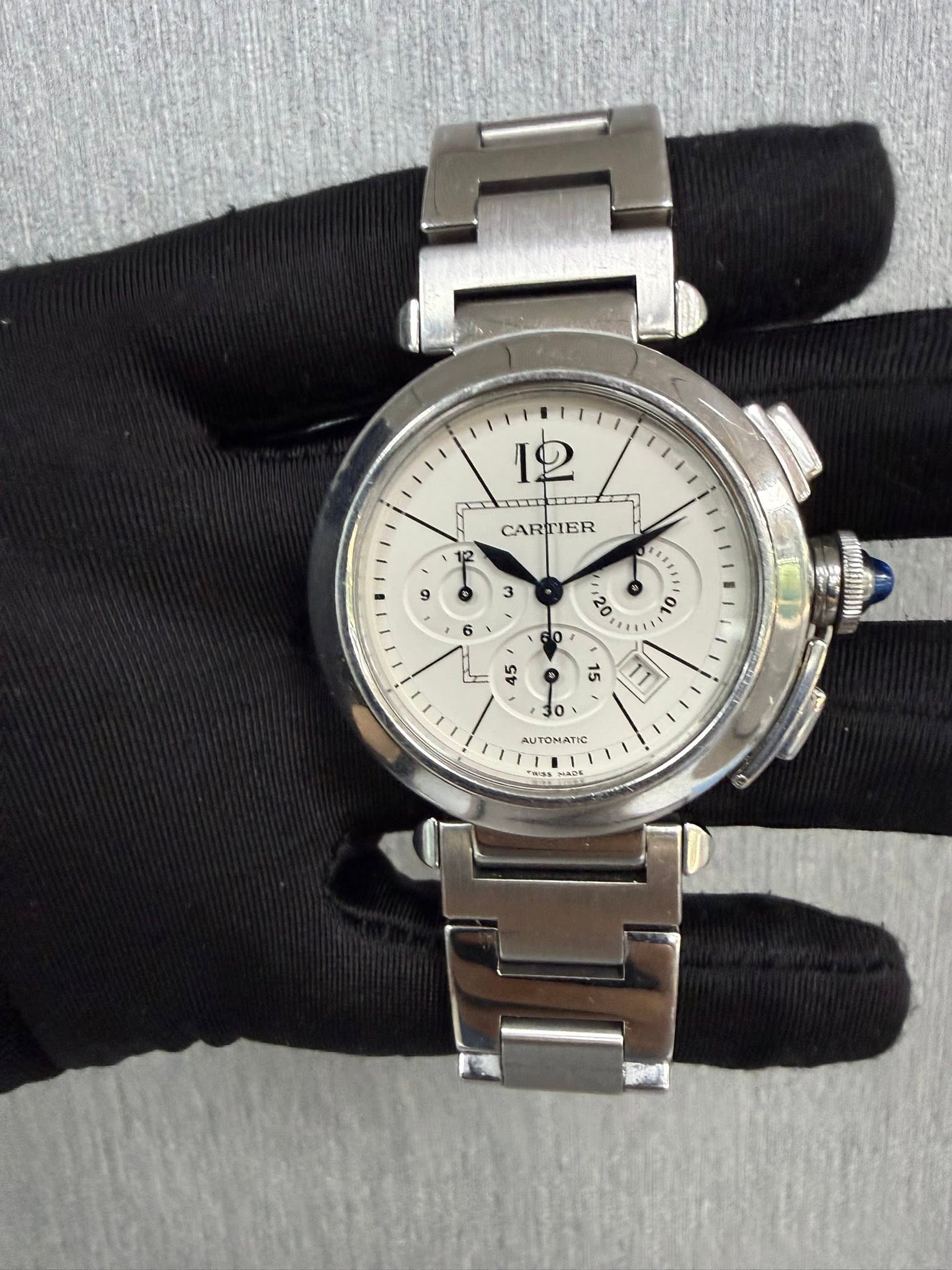 May be an image of wrist watch and text