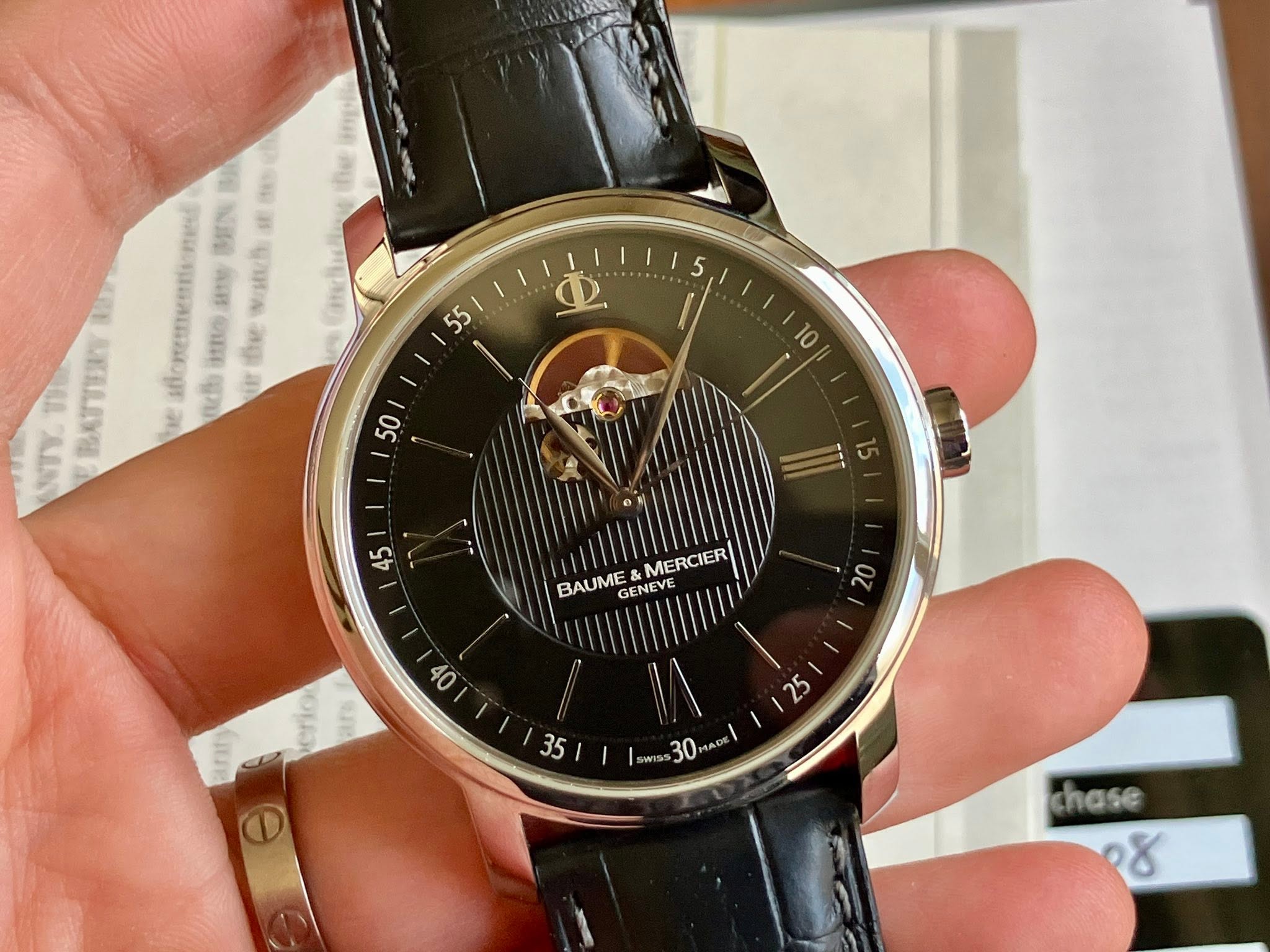 May be an image of wrist watch and text