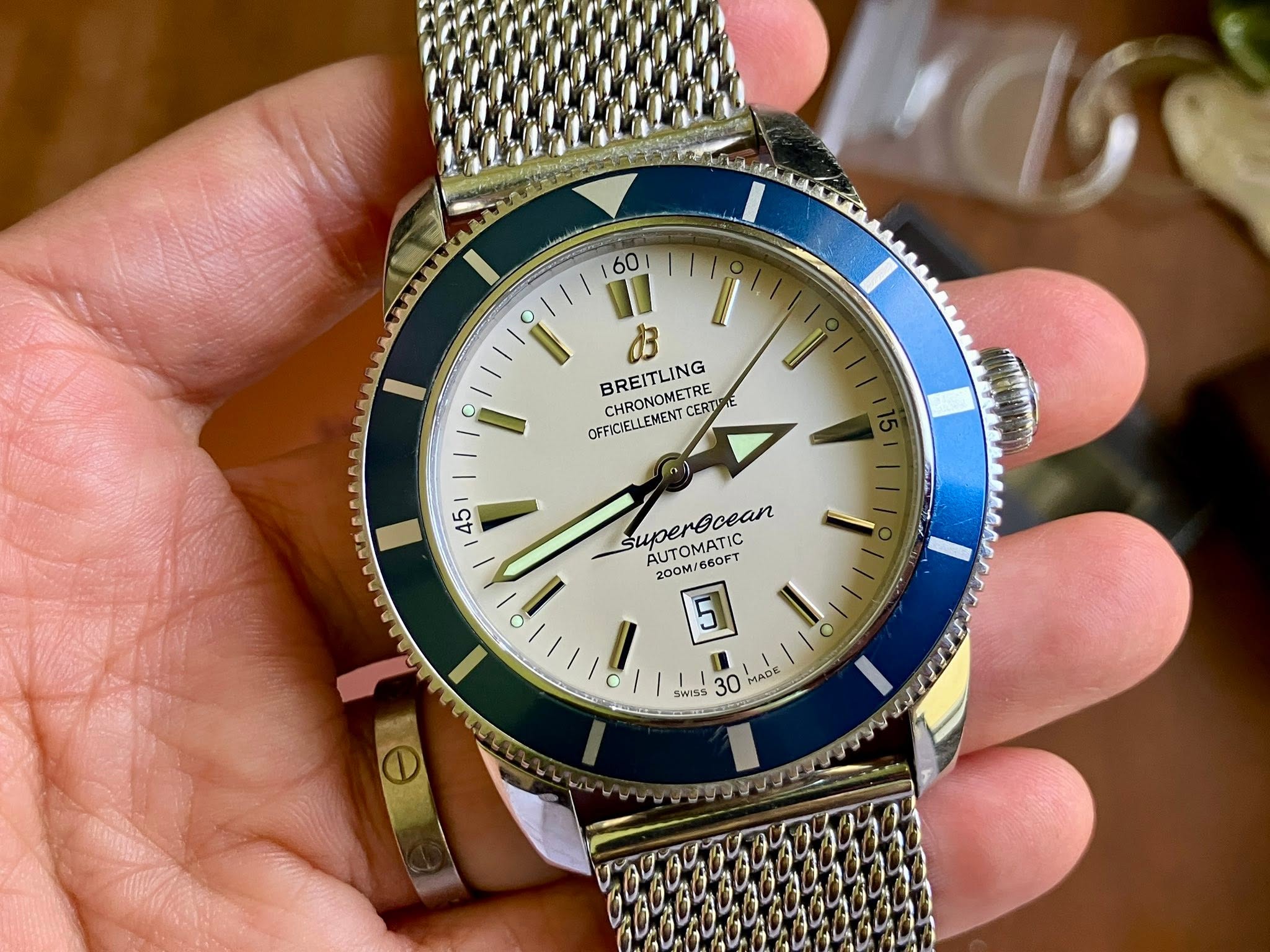 May be an image of wrist watch and text that says '60 I I お CHRONOMETRE BREITLING OFFICIELLEMENT CERTI ERT 45 I superecean AUTOMATIC AUTOMATIC 00M/660FT 660FT 200M 5 SWISS 30 MAn…
