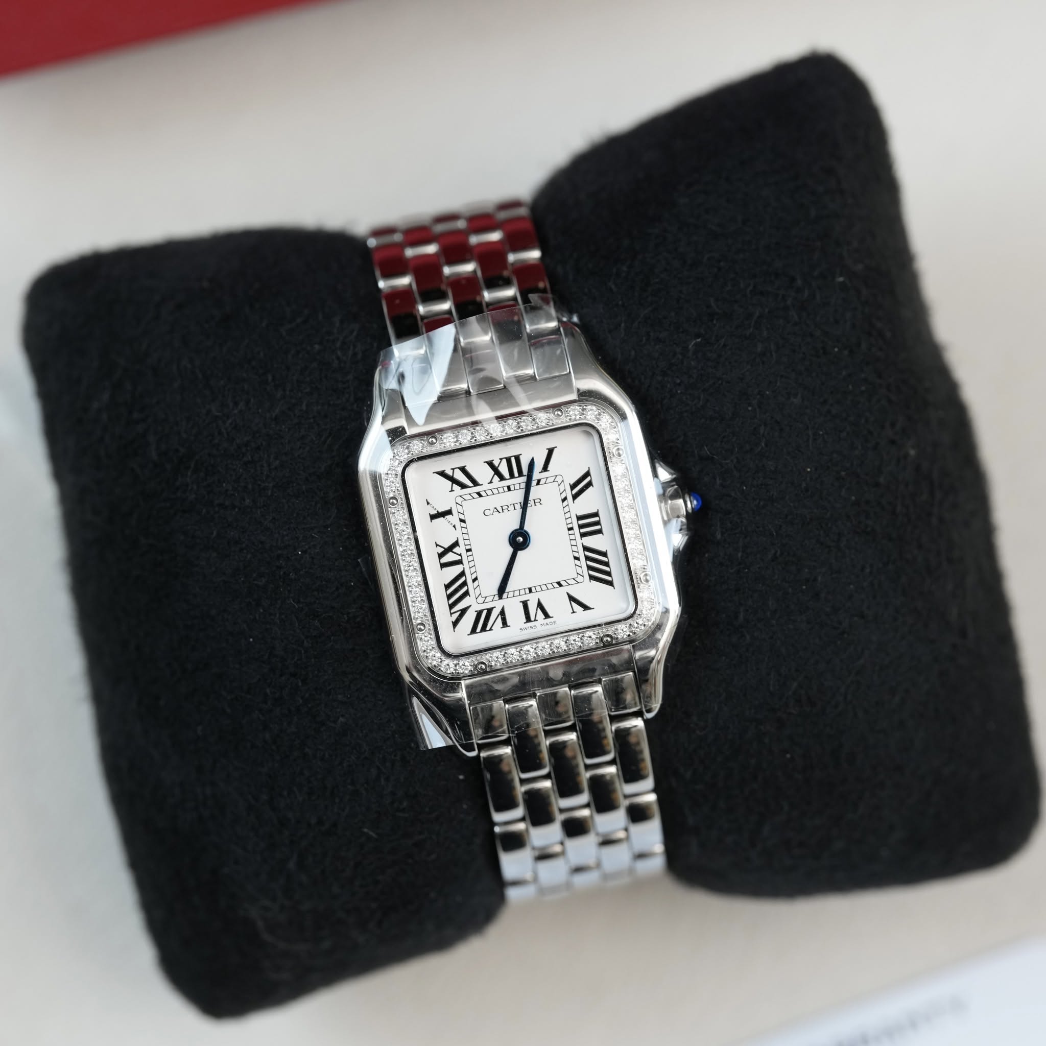 May be an image of wrist watch and text