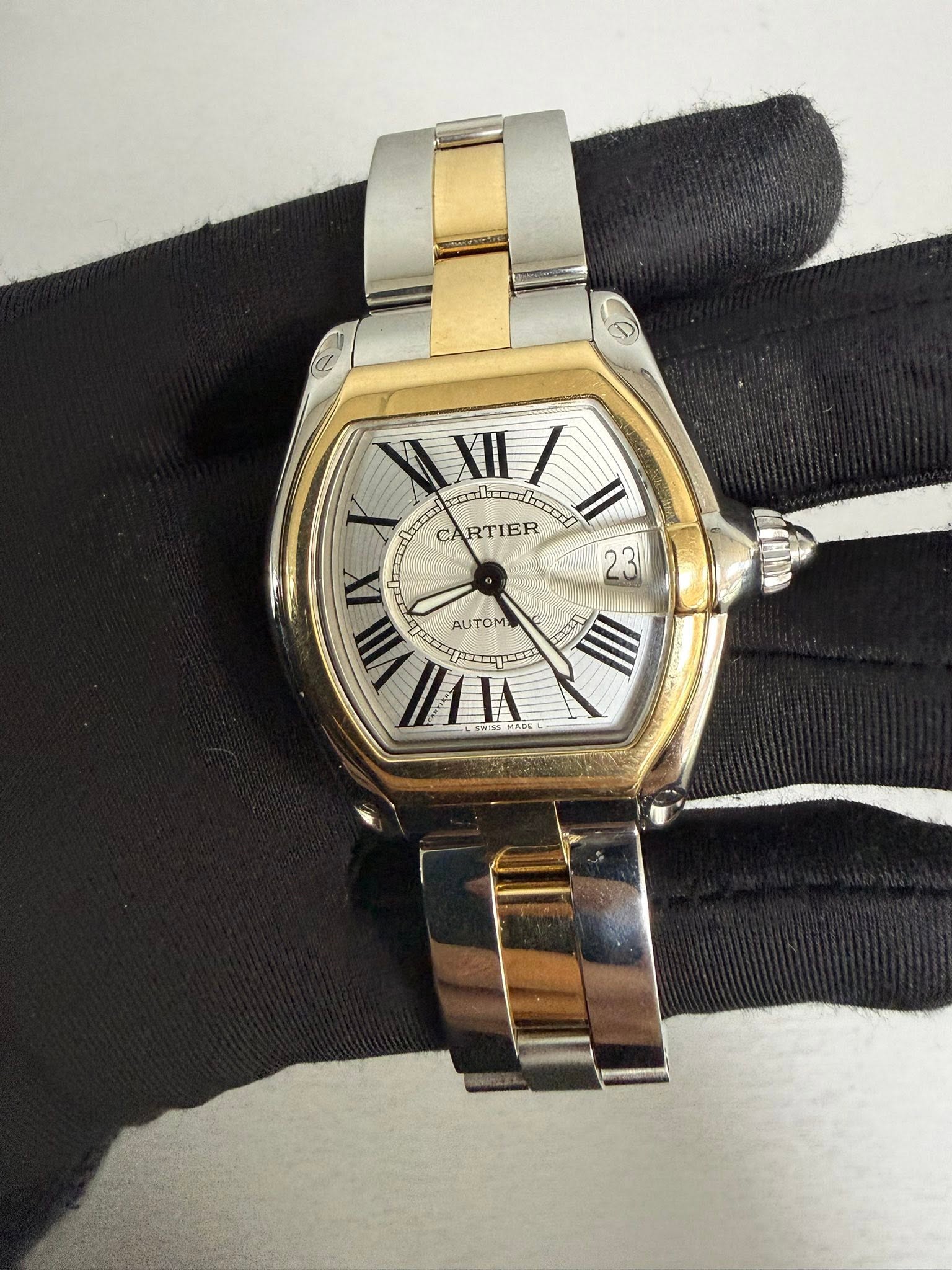 May be an image of wrist watch and text