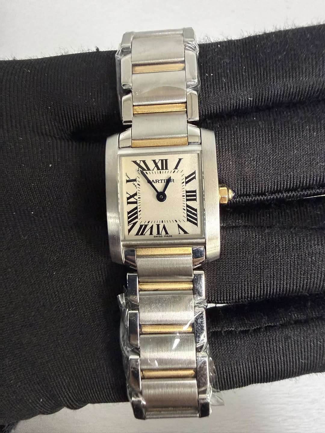 May be an image of wrist watch and text