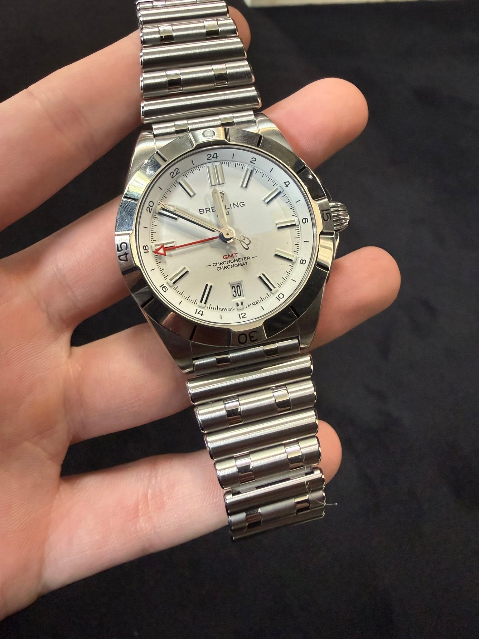 May be an image of wrist watch and text
