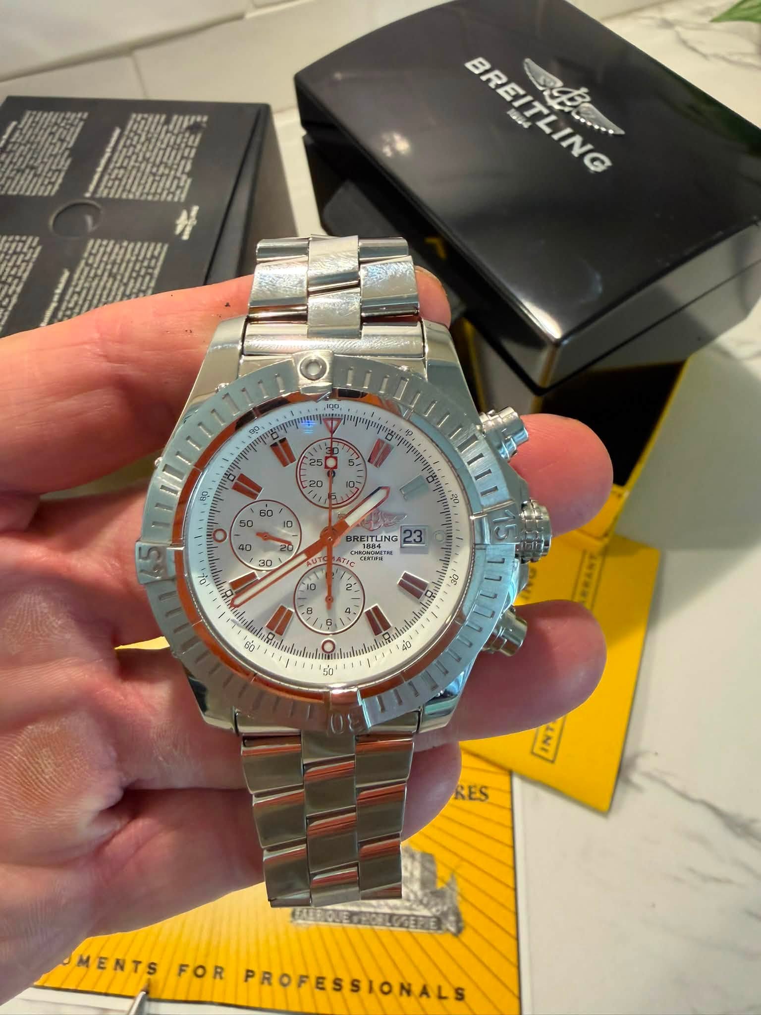 May be an image of wrist watch and text