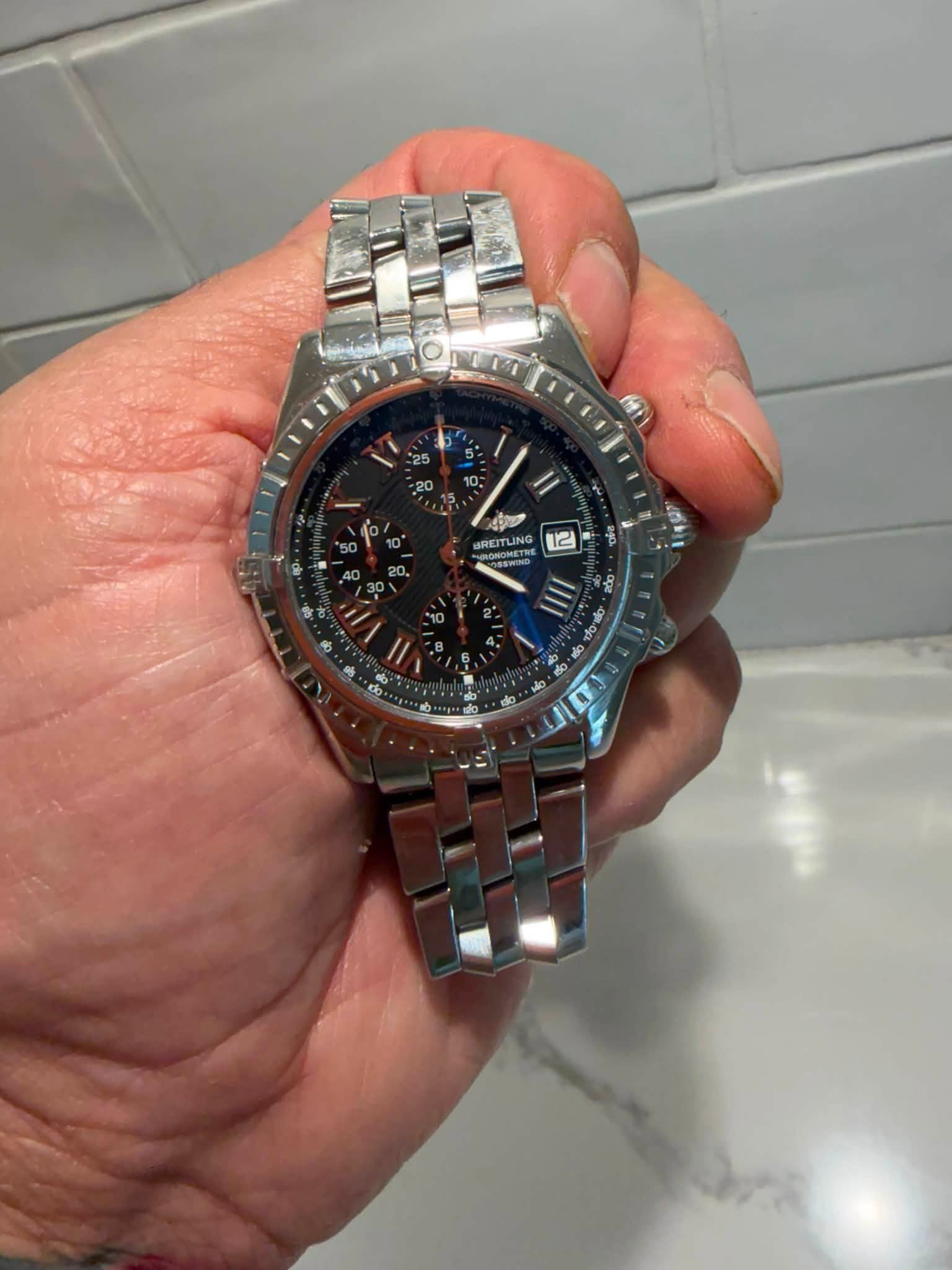 May be an image of wrist watch and text