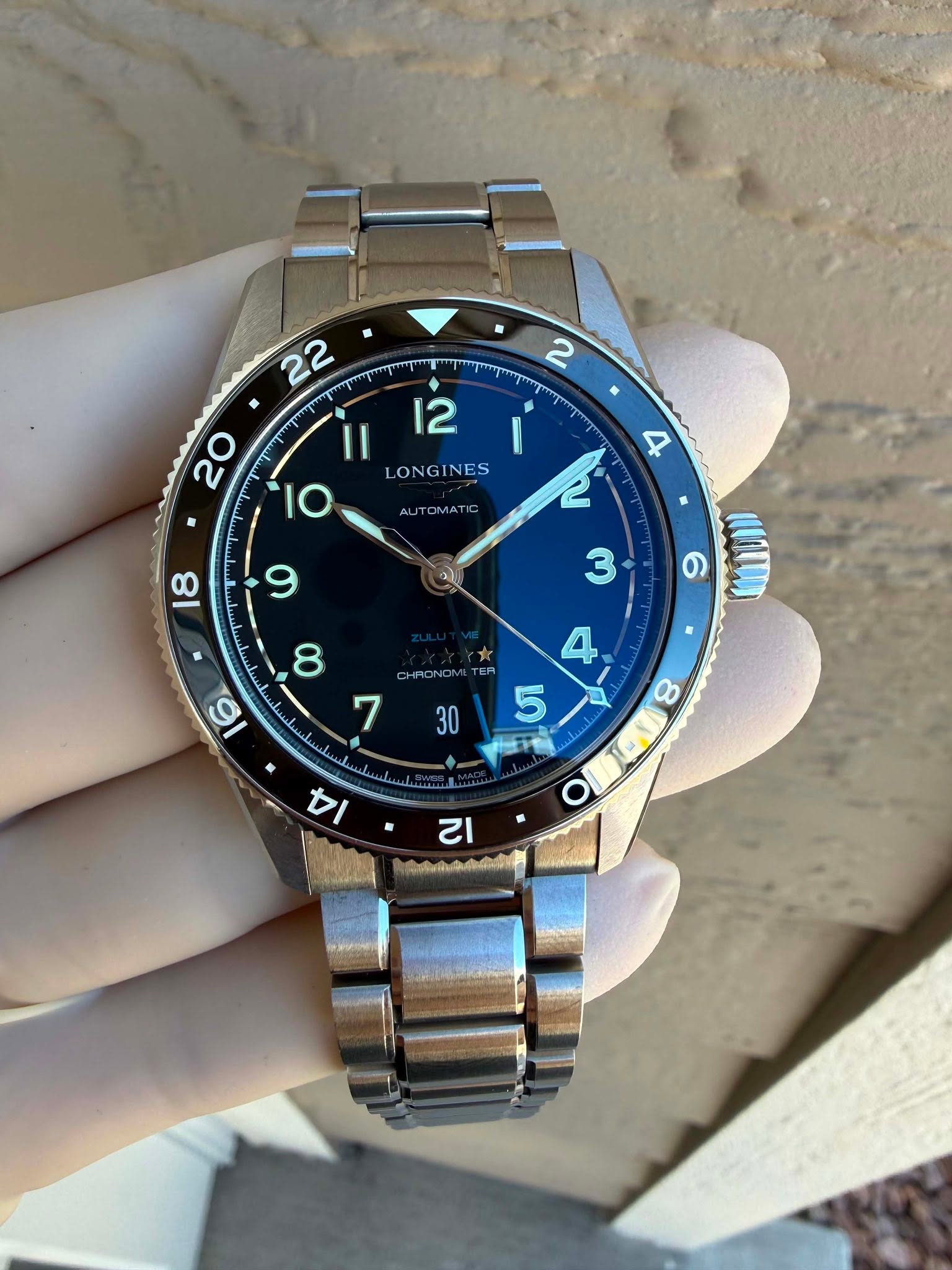 May be an image of wrist watch and text