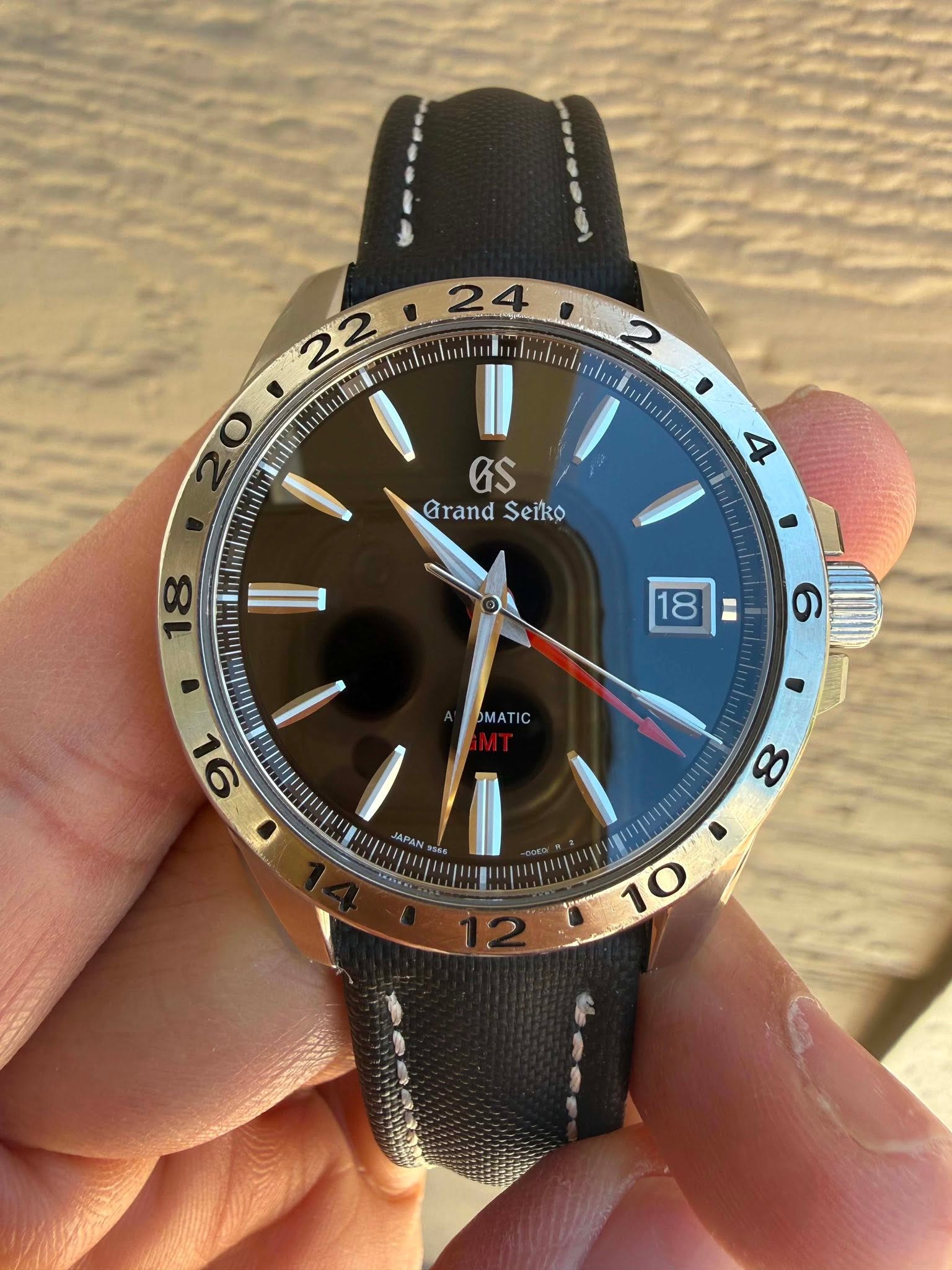 May be an image of wrist watch and text