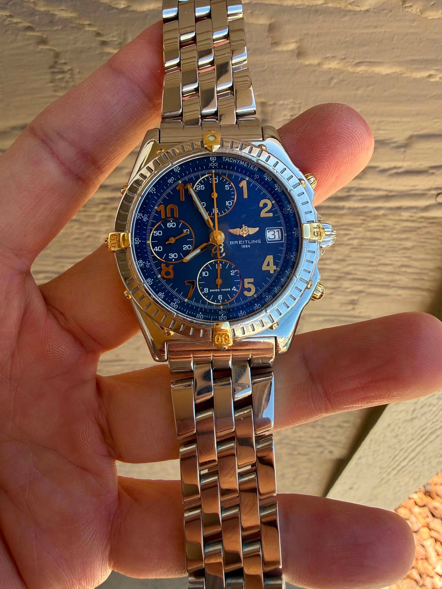 May be an image of wrist watch and text that says 'TACHYETE M 明 ING oF 4, 5'