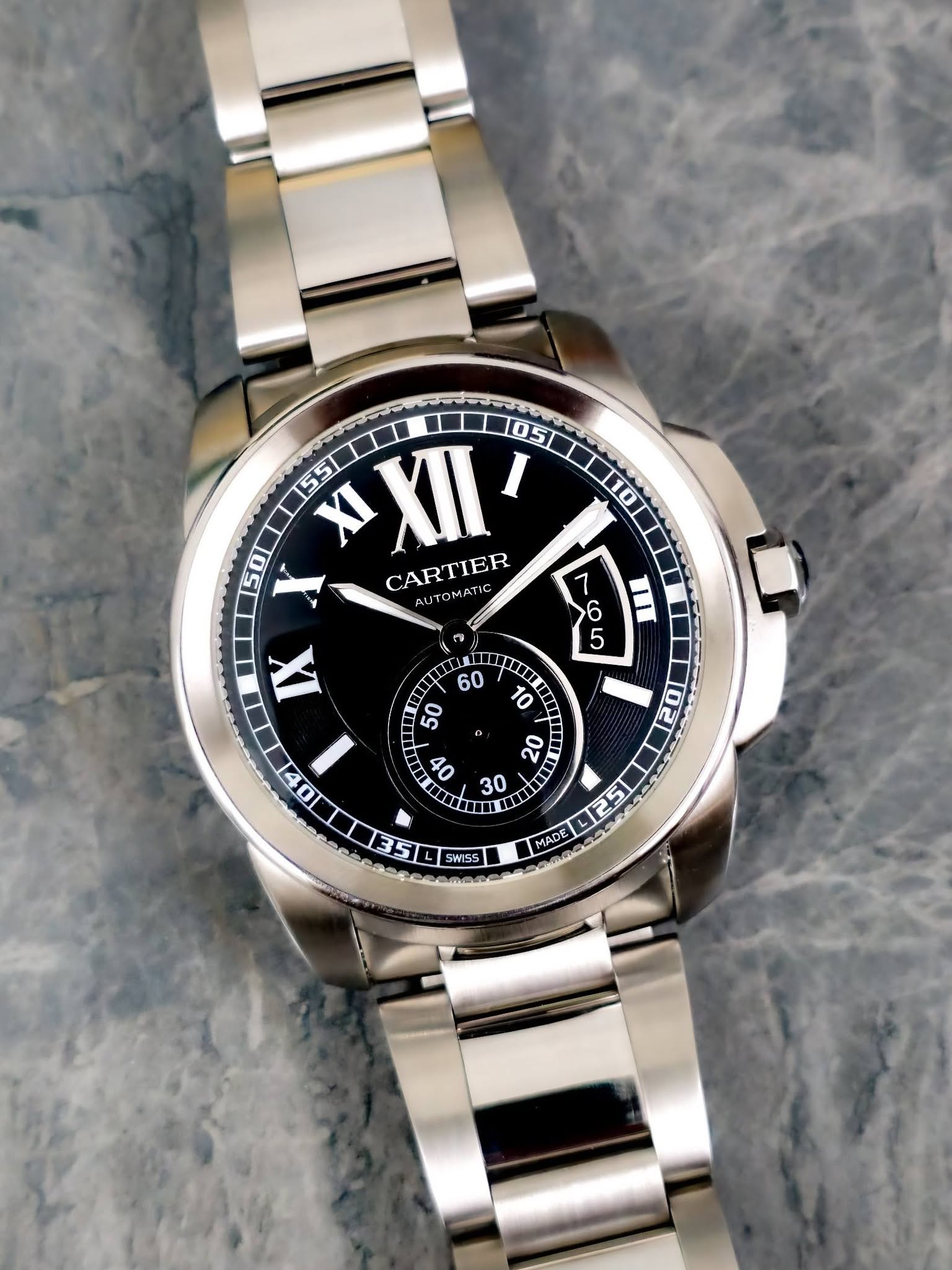 May be an image of wrist watch and text that says '10 05T 55 XXII I 50 X CARTIER AUTOMATIC 7 6 II 5 ๓ IX 0 60 န1်1 50 10 C0 il D தய 20 0 قه E II 30 4251 MADE MADE س 100 വലരകയട…