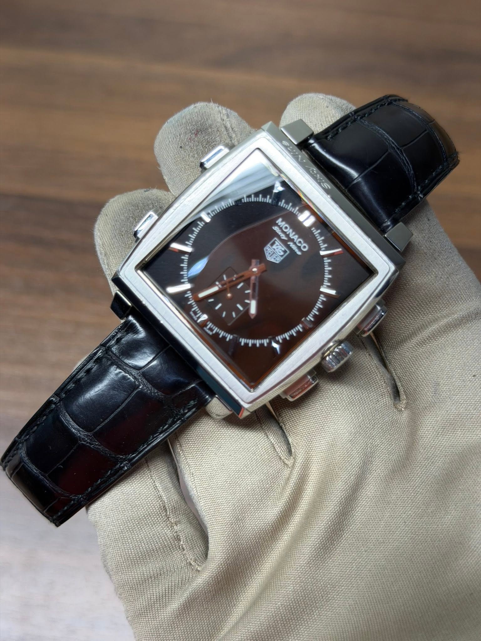 May be an image of wrist watch and text