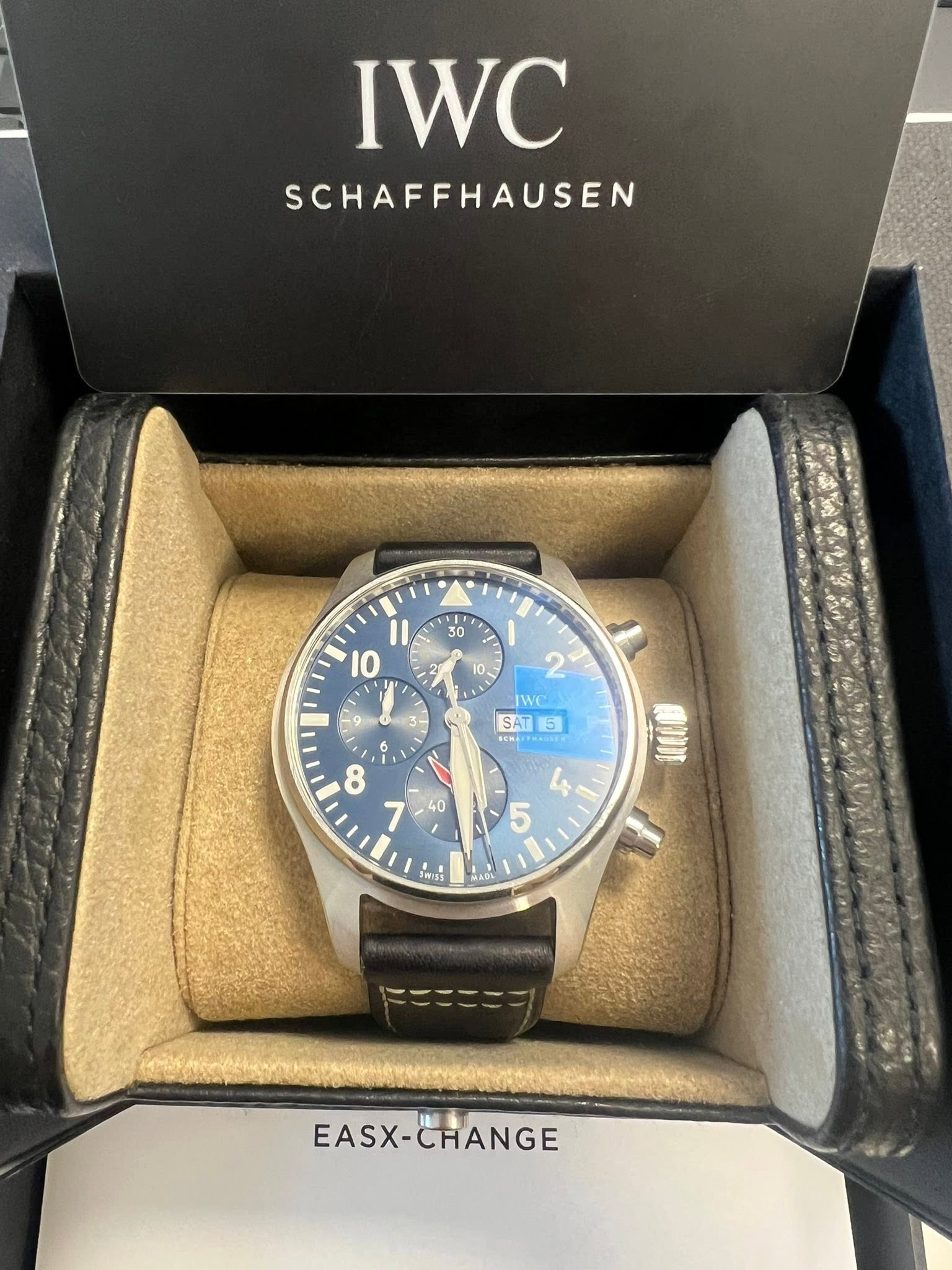 May be an image of wrist watch and text that says 'IWC SCHAFFHAUSEN 、 0 2 10 / + 1 10 ١١ ١٠ - WC SAT SAT5 5 CHA 6 i I V la 5 HINE MADA A EASX-CHANGE EASX- CHANGE'