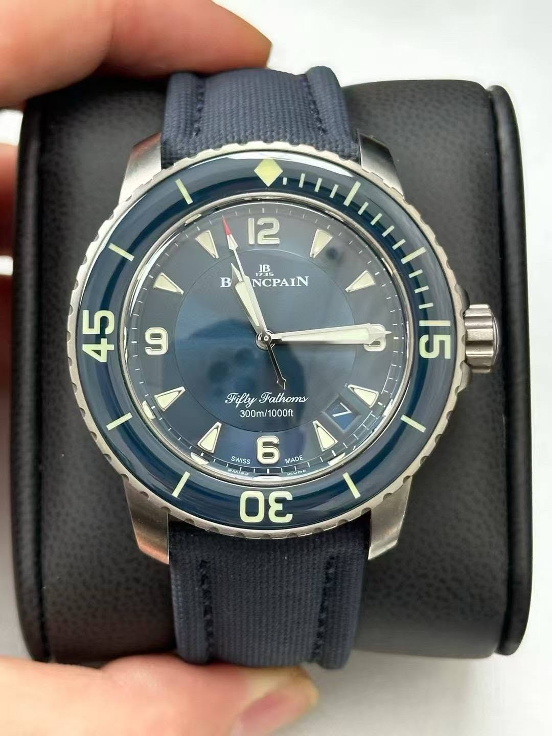 May be an image of wrist watch and text that says '12 JB B BONCPAIN NCPAIN V + 9 45 J Filly Fathoms 300m/1000ft 300ml 15 In SWISS 6 MADE لد ANS E 30 D0 الکاتة'