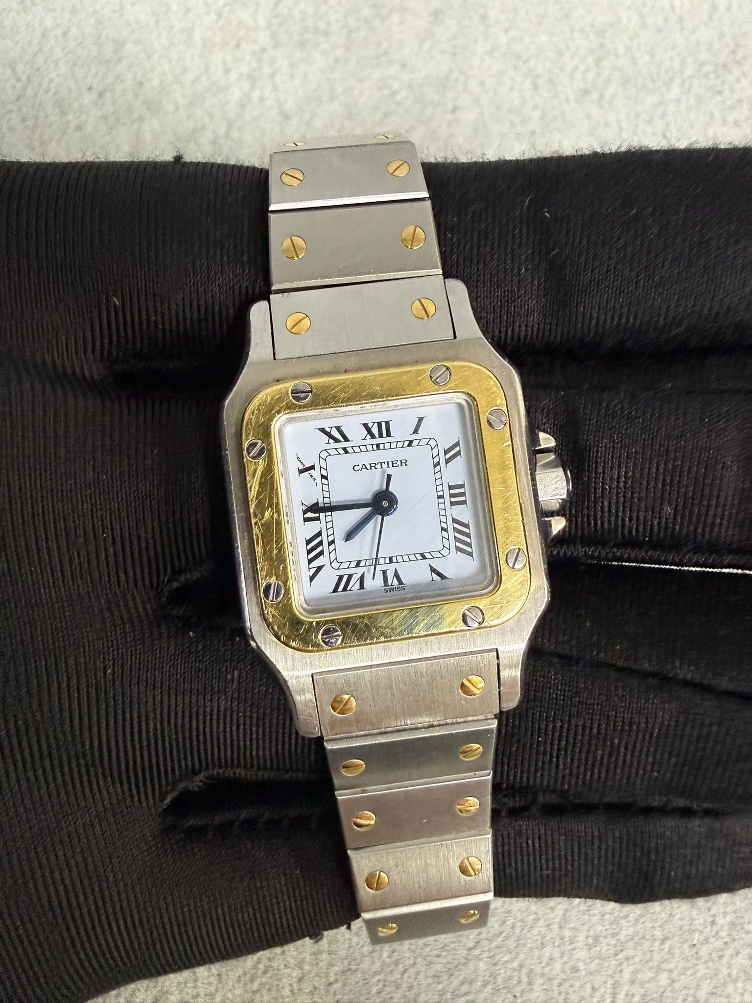 May be an image of wrist watch and text