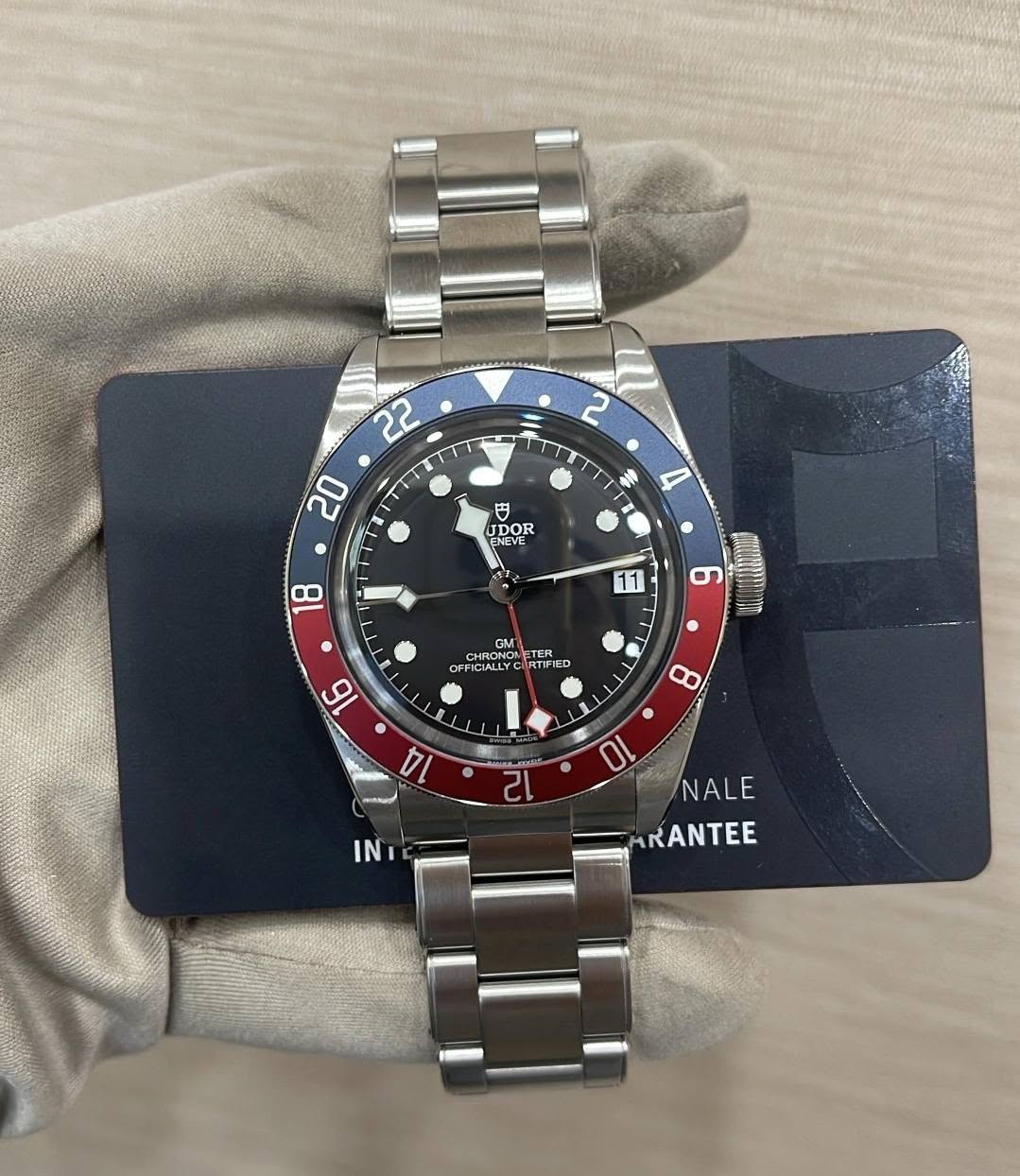 May be an image of wrist watch and text