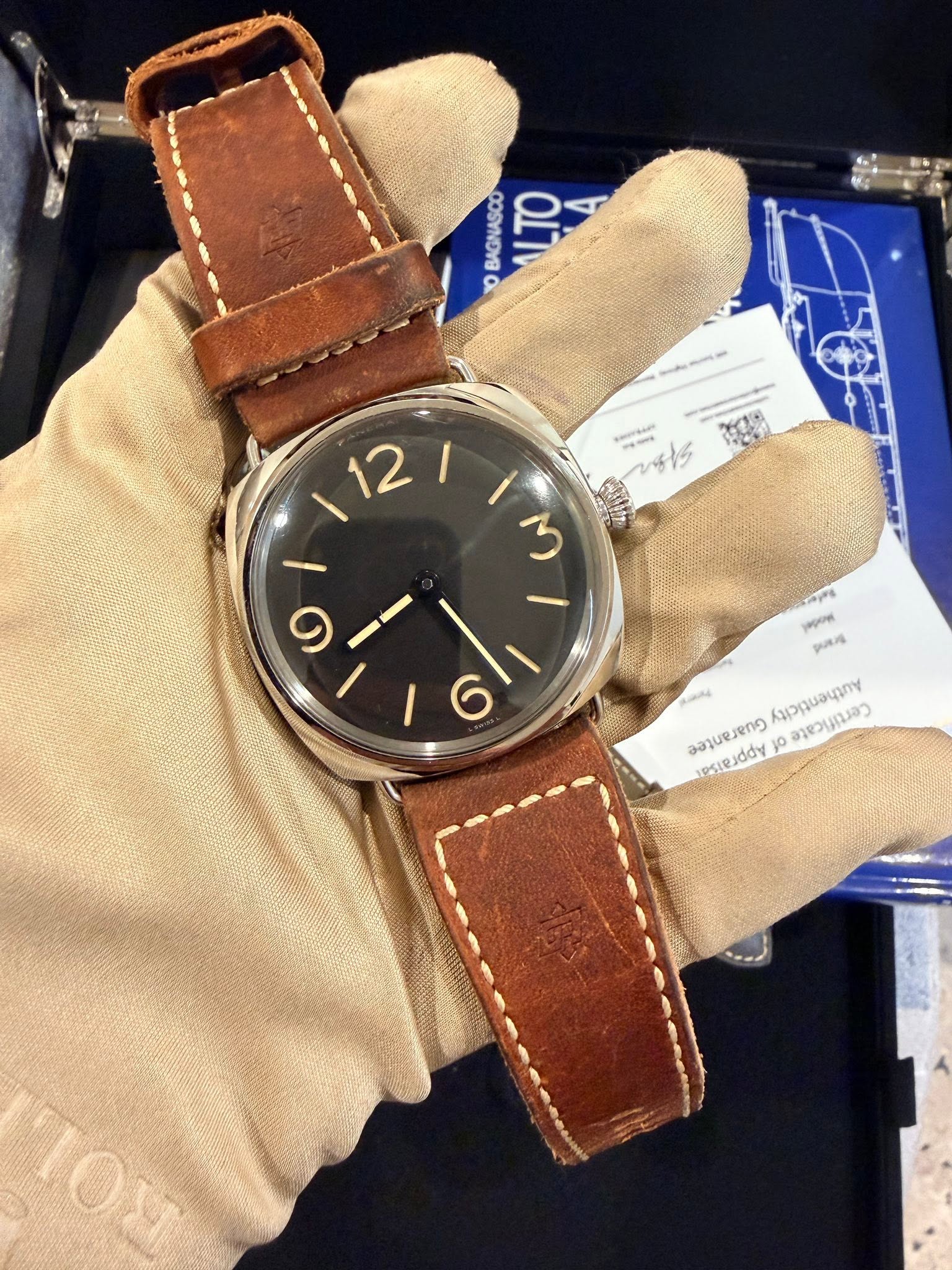 May be an image of wrist watch, leather and text