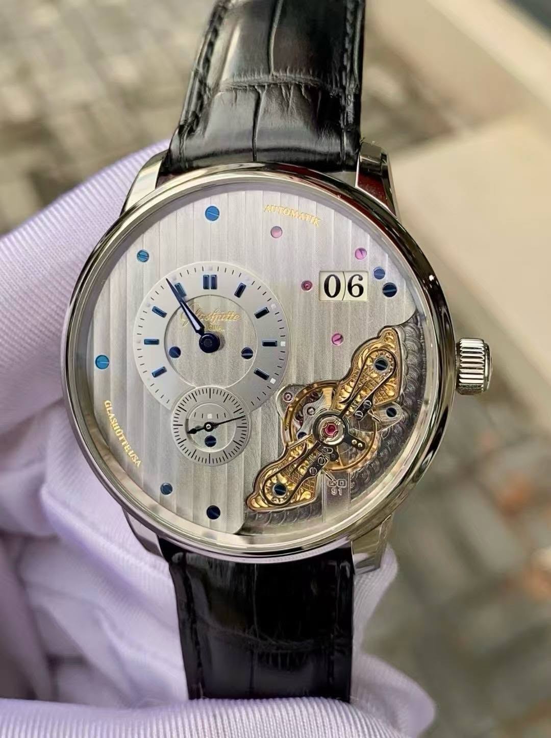 May be an image of wrist watch and text