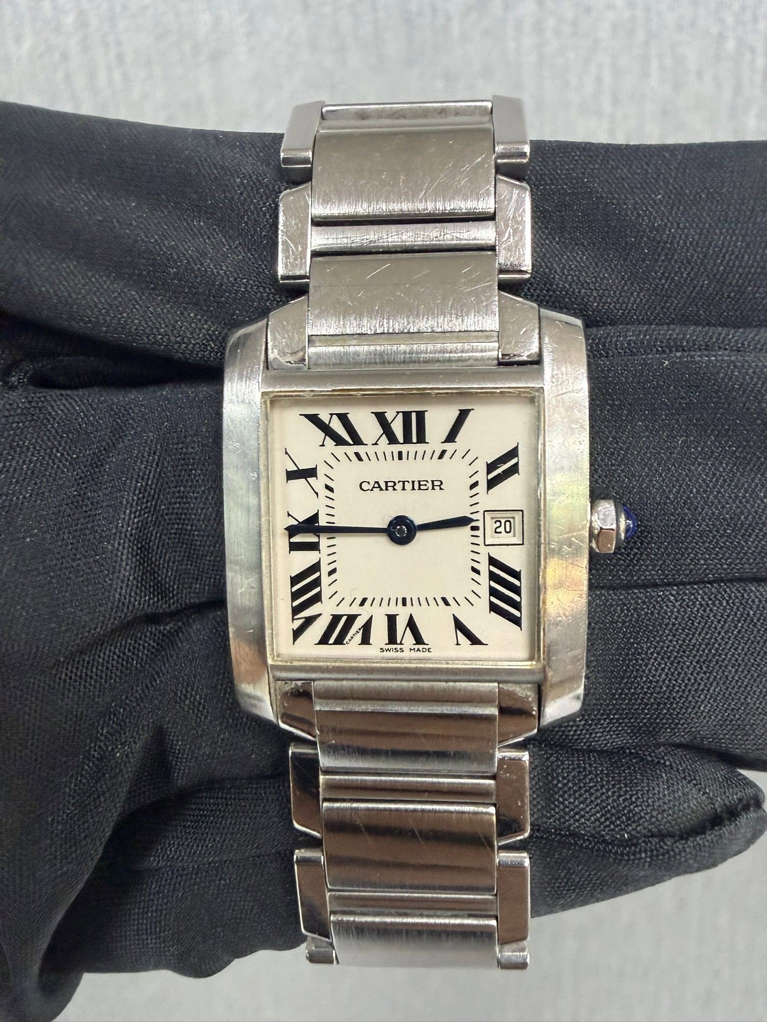 May be an image of wrist watch and text