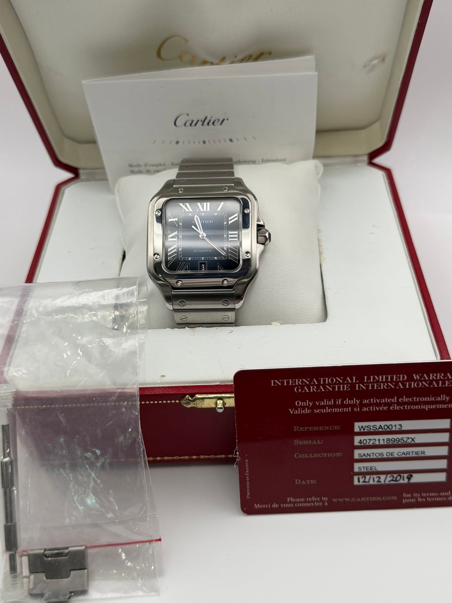 May be an image of digital watch and text that says 'Cartier mmnue ErRImenesi WSSA0013 WSSA0013 407211 40721189957X 8995ZX SANTOS SANTOS.DECARTIER CARTIE STEEL STEEL 12/12/2019…