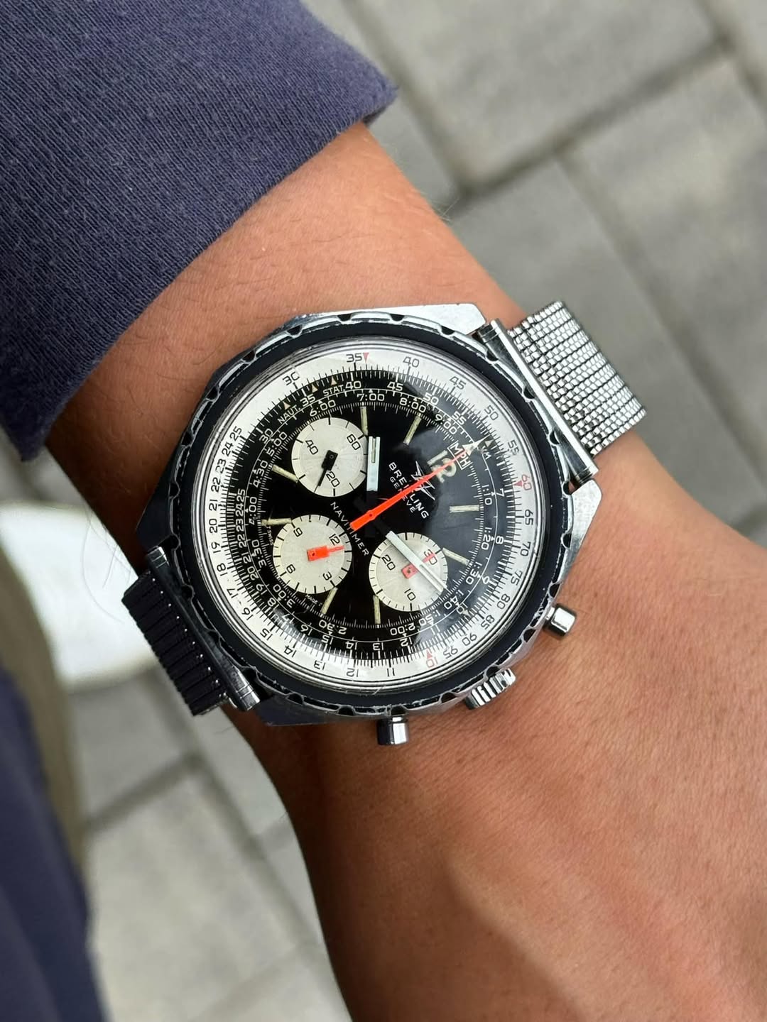 May be an image of wrist watch and text