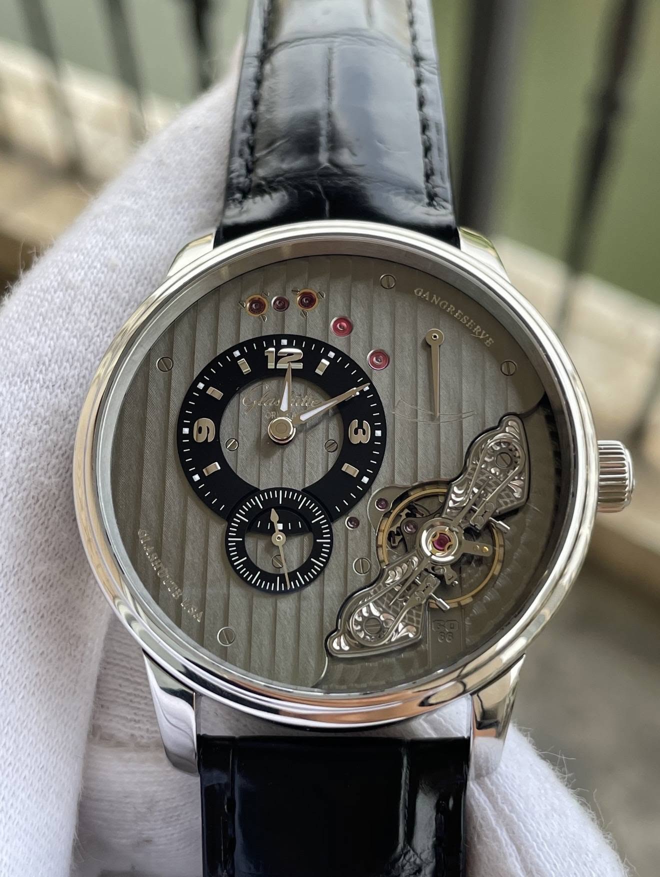 May be an image of wrist watch and text
