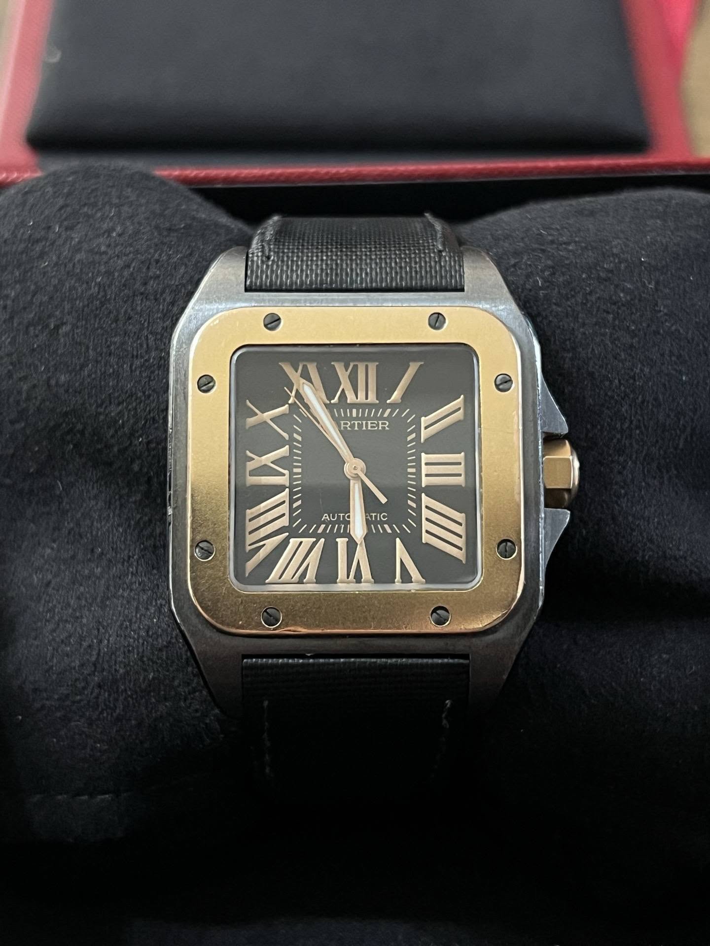 May be an image of wrist watch and text