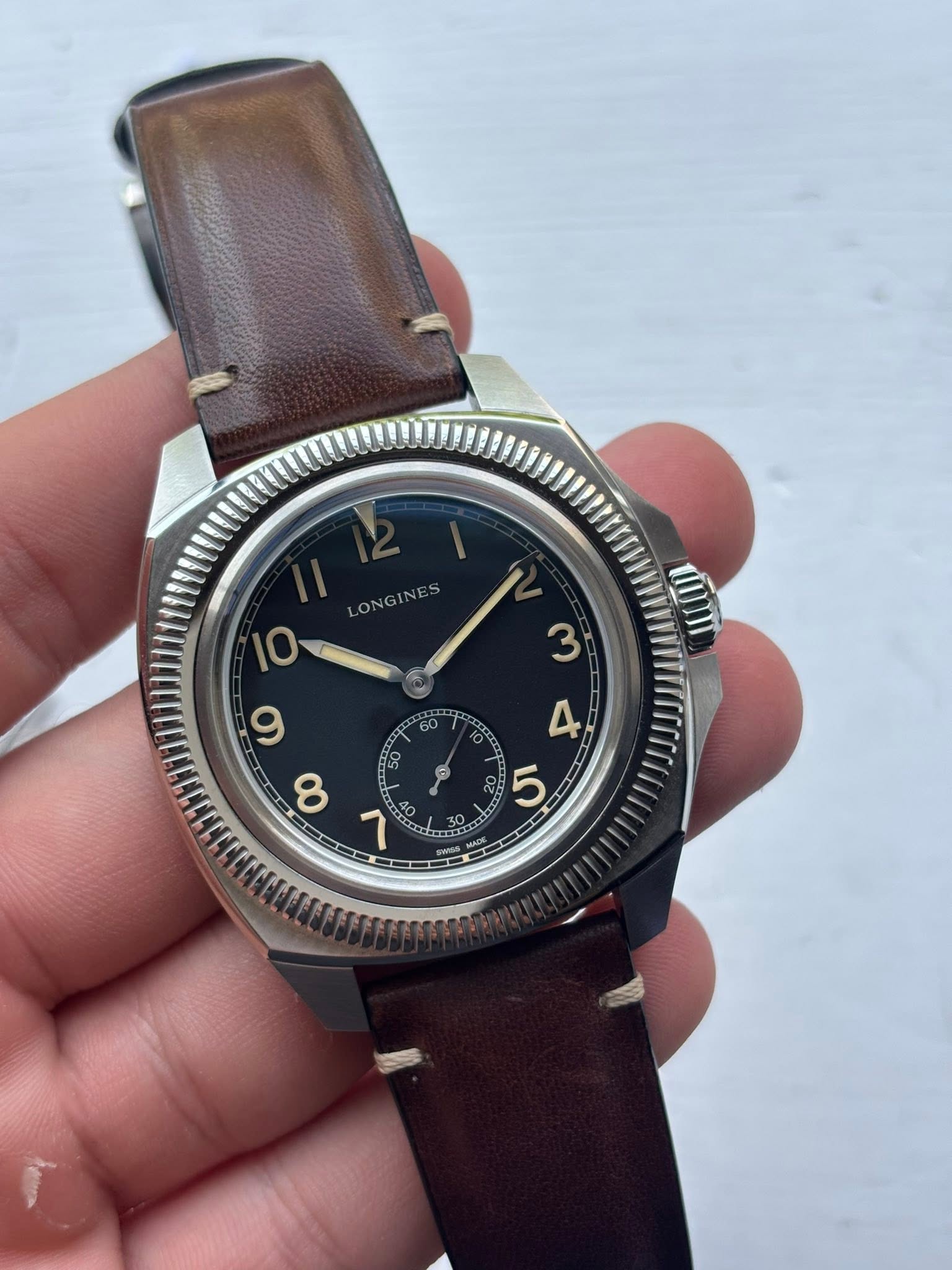 May be an image of wrist watch and text that says 'ONGINES ON س 8 BC'