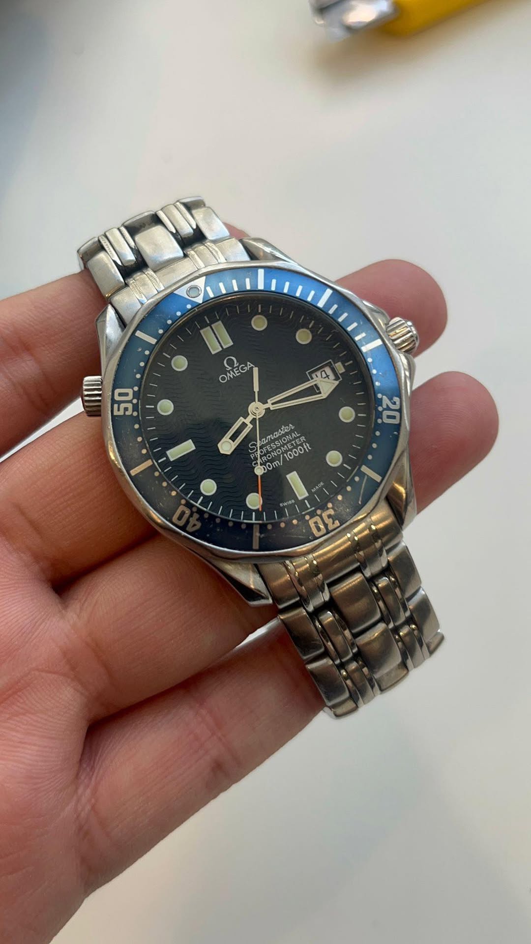 May be an image of wrist watch and text