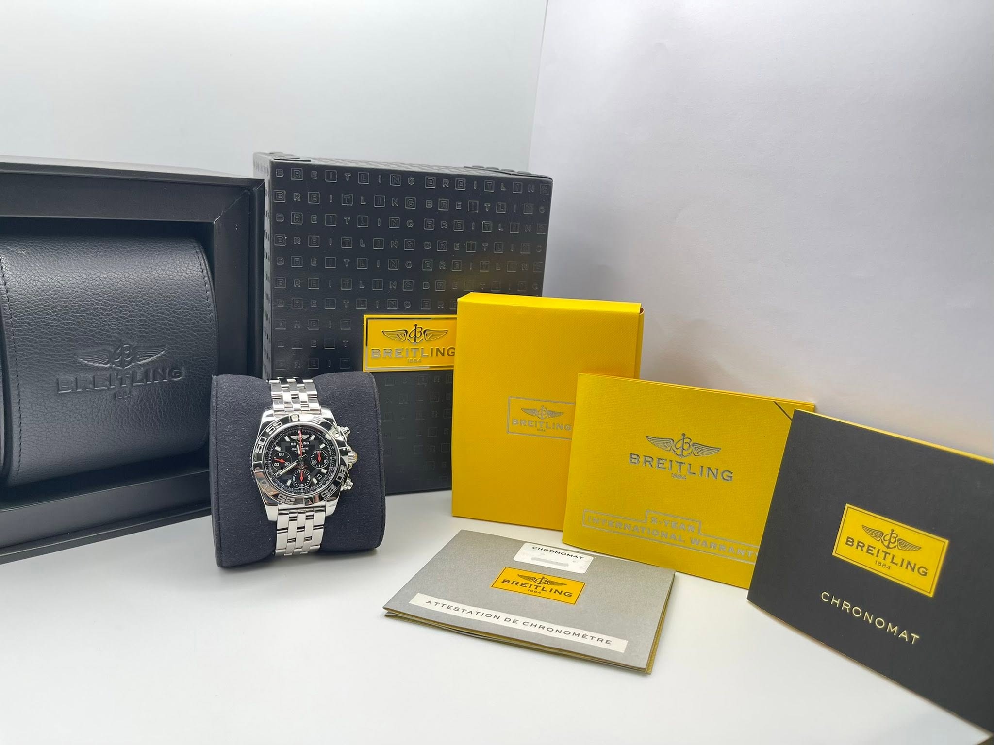 May be an image of leather, wrist watch and text