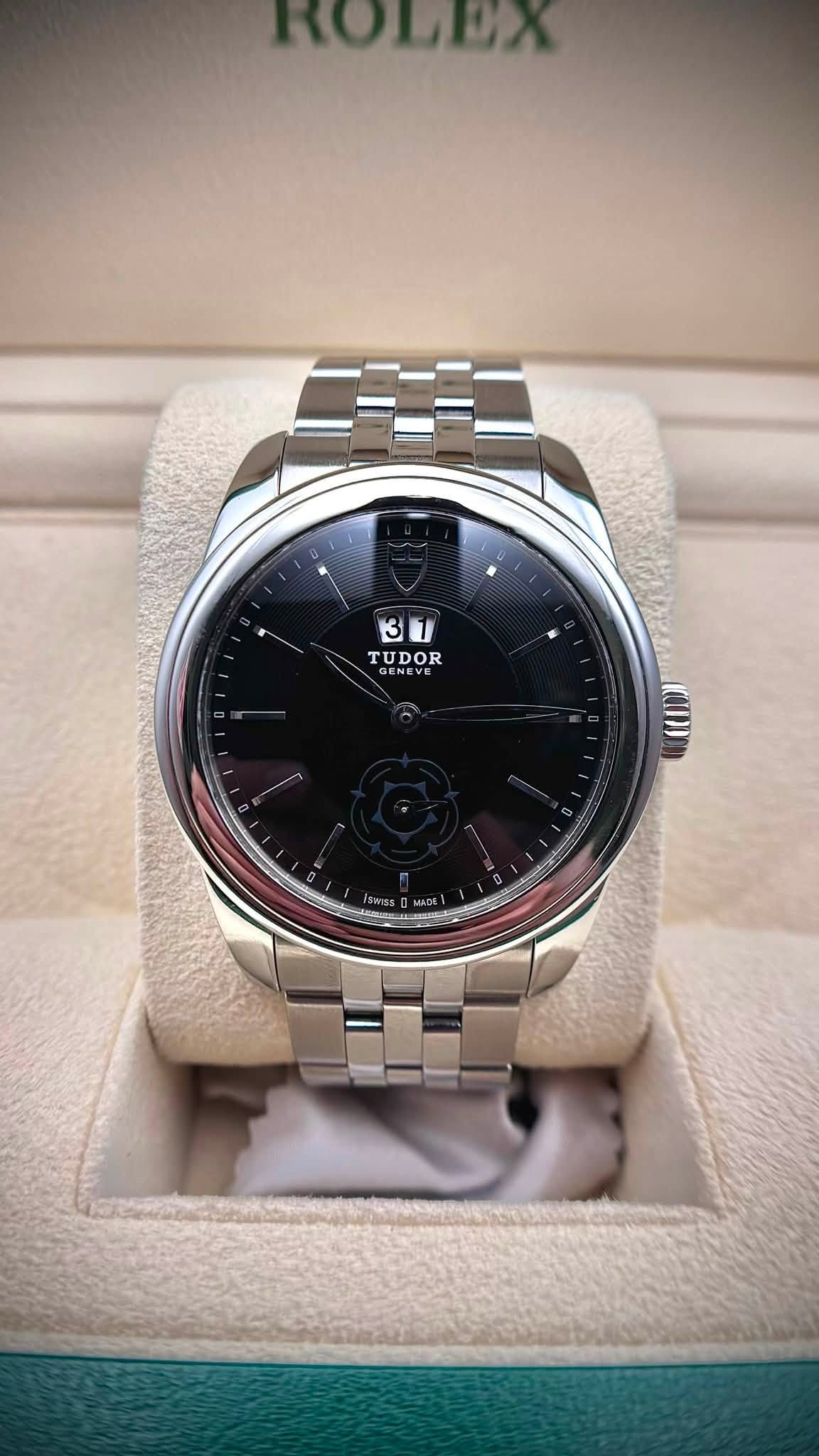 May be an image of wrist watch and text that says 'ROLEX 31 3 TUDOR GE GENEVE TUDOR ENE VE'