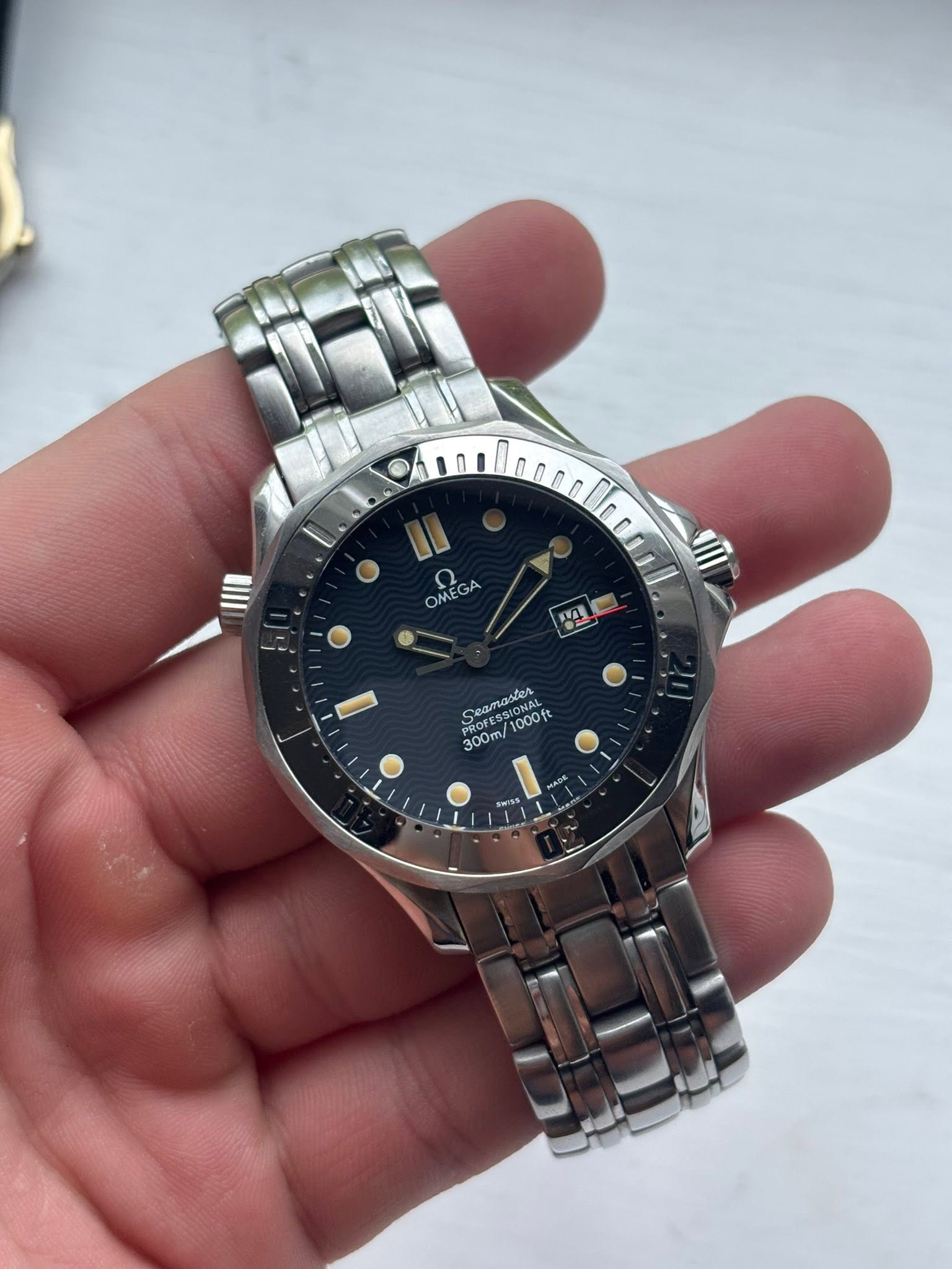 May be an image of wrist watch and text
