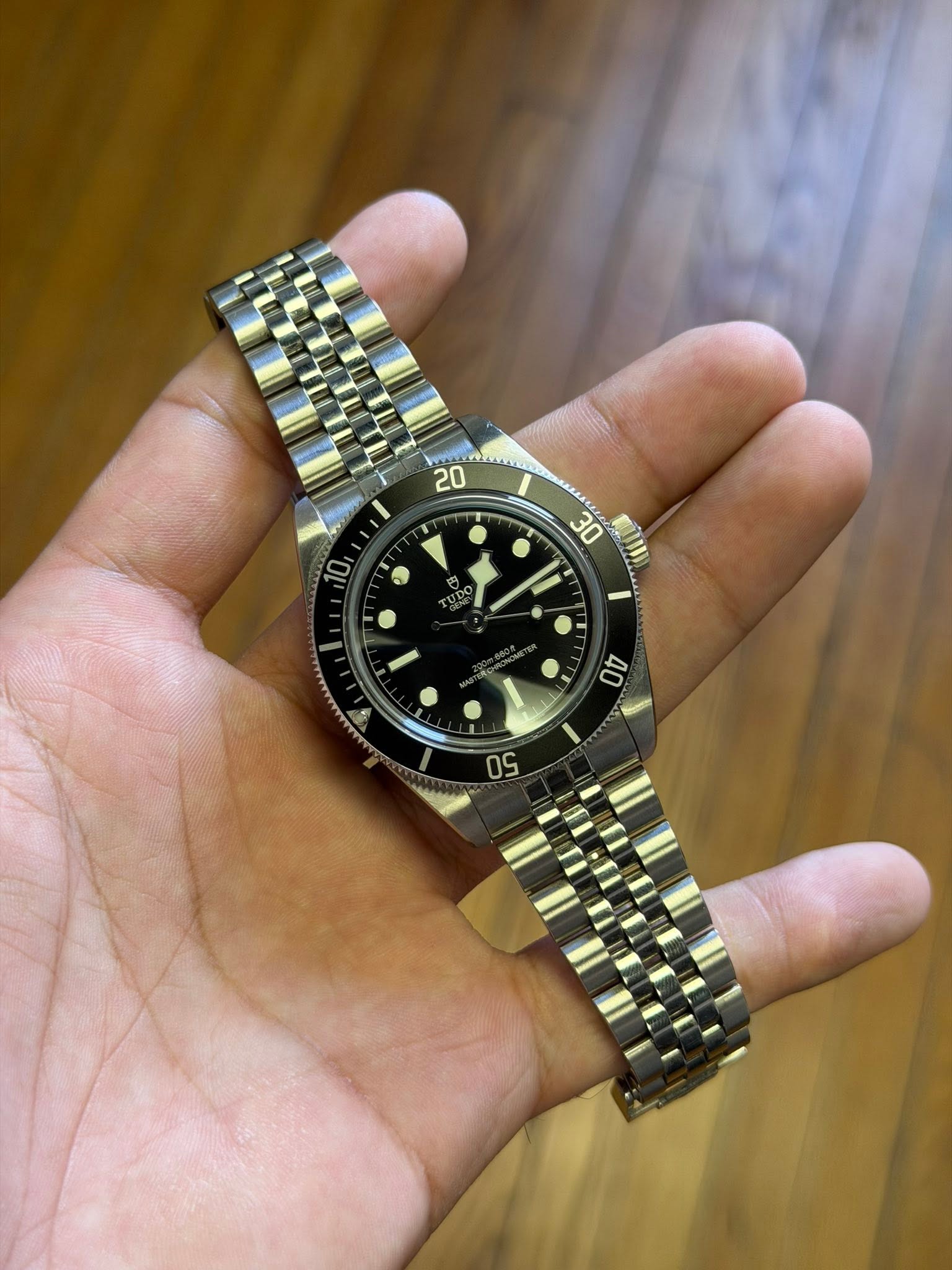 May be an image of wrist watch and text