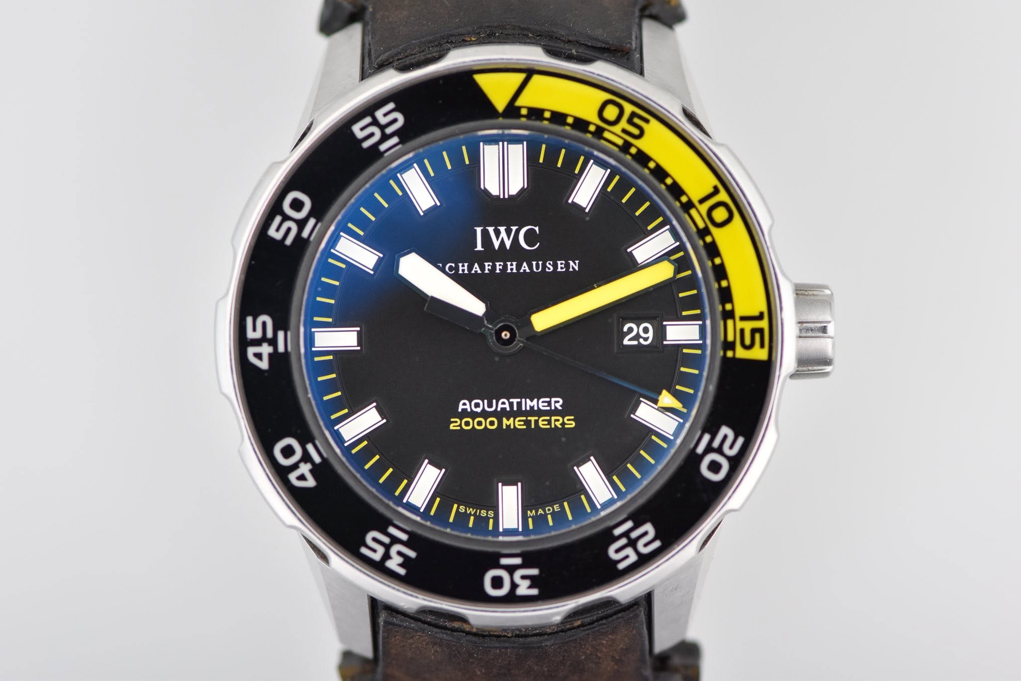May be an image of wrist watch and text that says ' IWC CHAFFHAUSEN 45 = 29 15 AQUATIMER 2000 METERS 01 I O 00 l. SWISS ε όε 02 ร'
