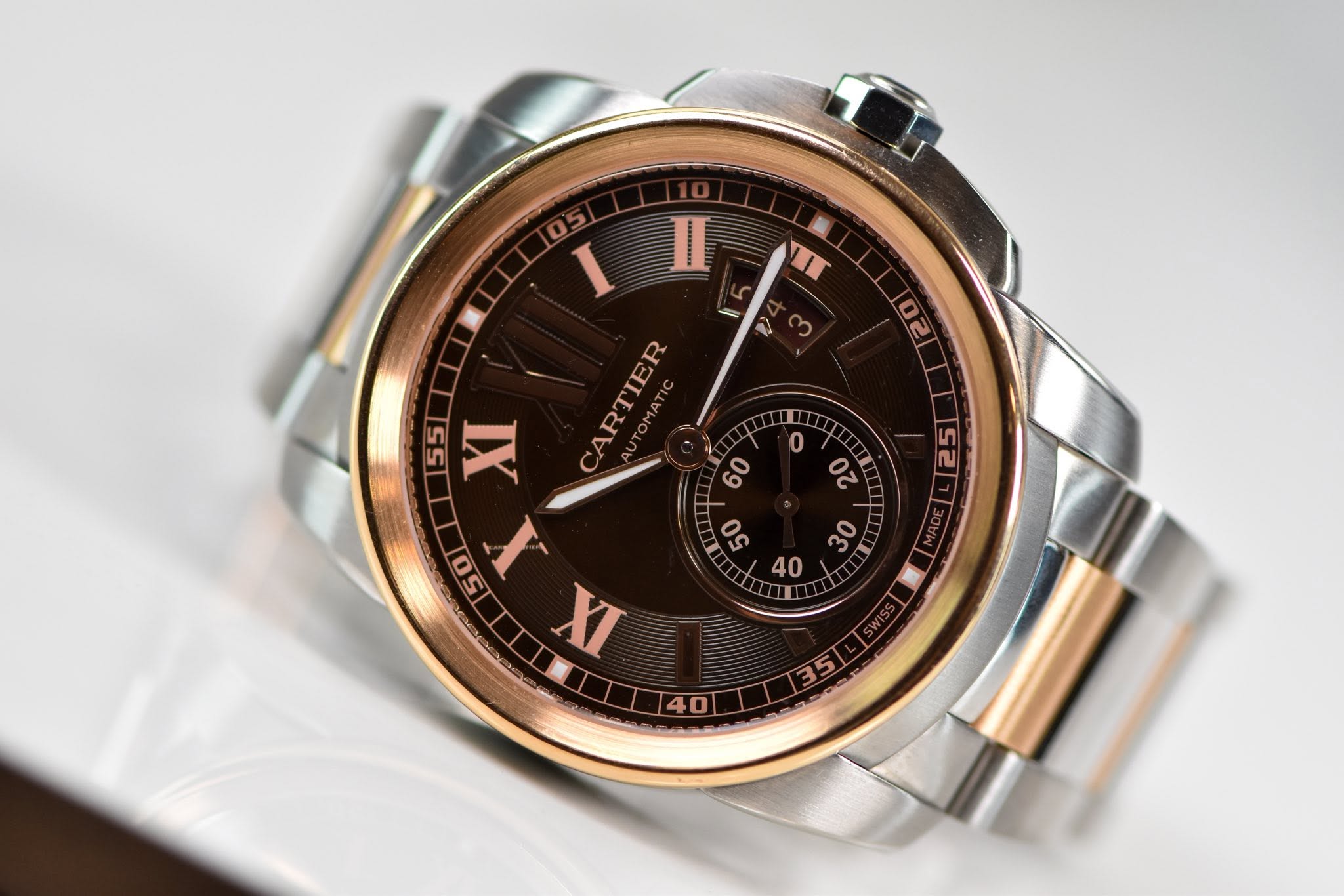 May be an image of wrist watch and text that says 'II IT 1 ت 0 02 2 f 5n ល 05 I 55 A 5 XI CARTIER 60 50 50 X 40 XI ហ្រៃ'