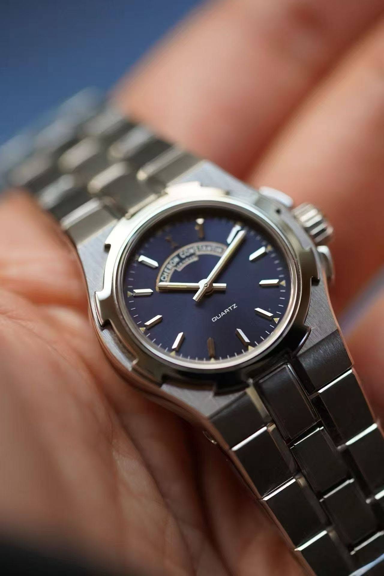 May be an image of wrist watch and text